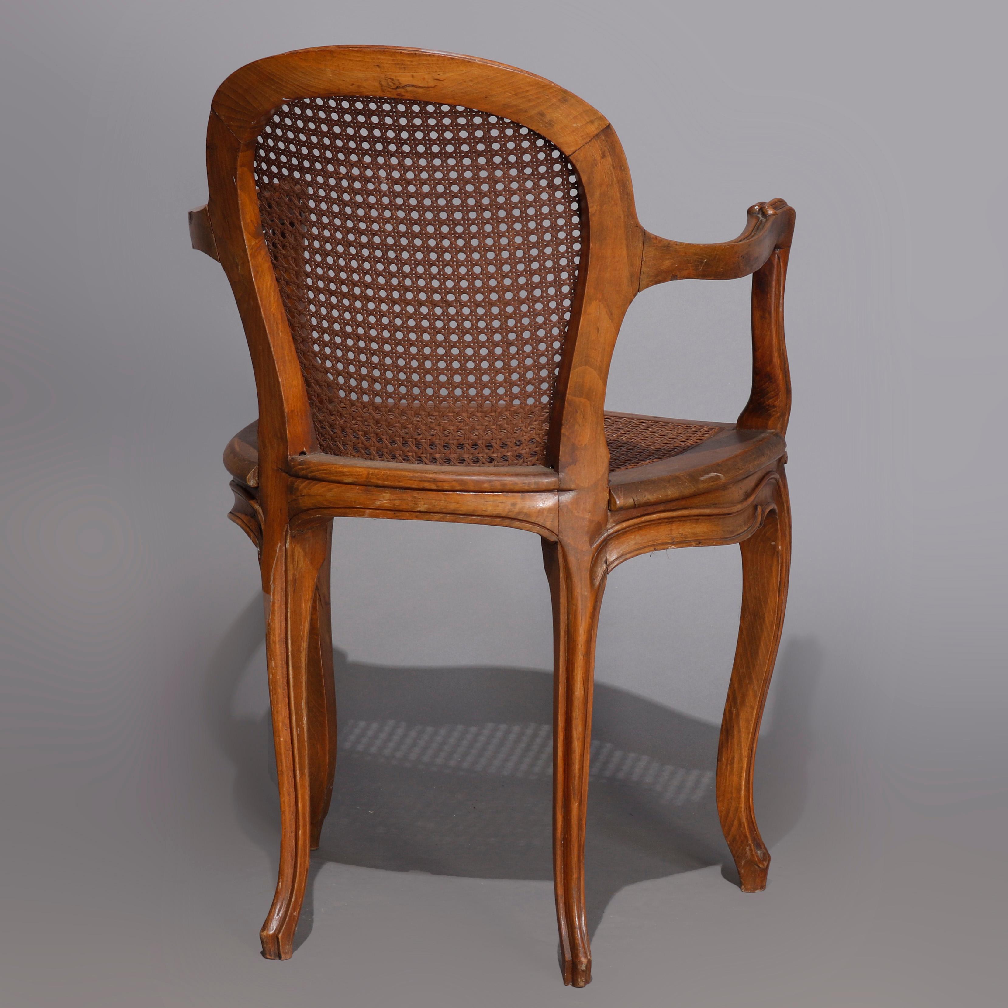 19th Century Set of Four Antique French Louis XVI Carved Walnut and Caned Armchairs