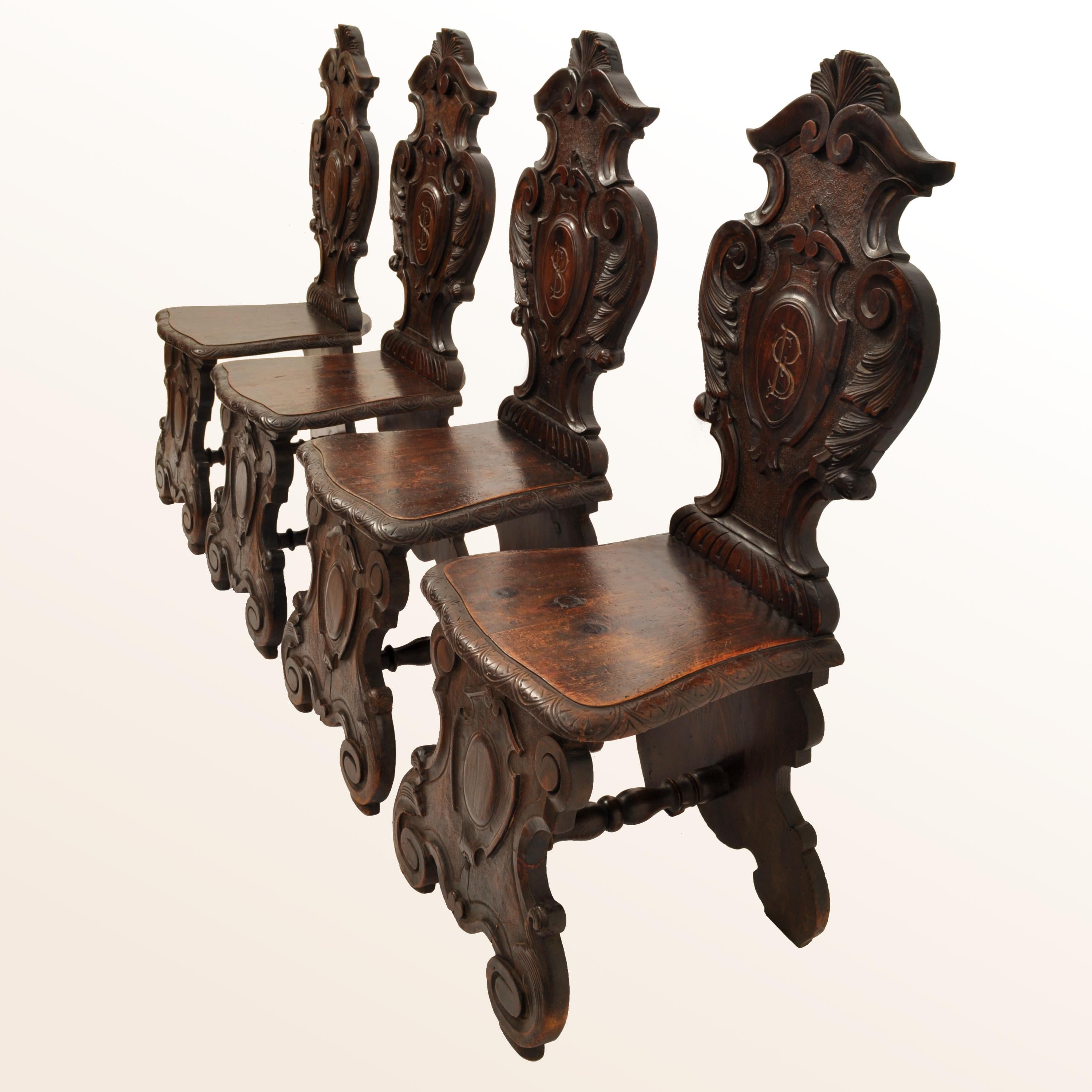 Renaissance Revival Set of Four Antique Italian Carved Walnut 18th Century Sgabello Hall Side Chairs