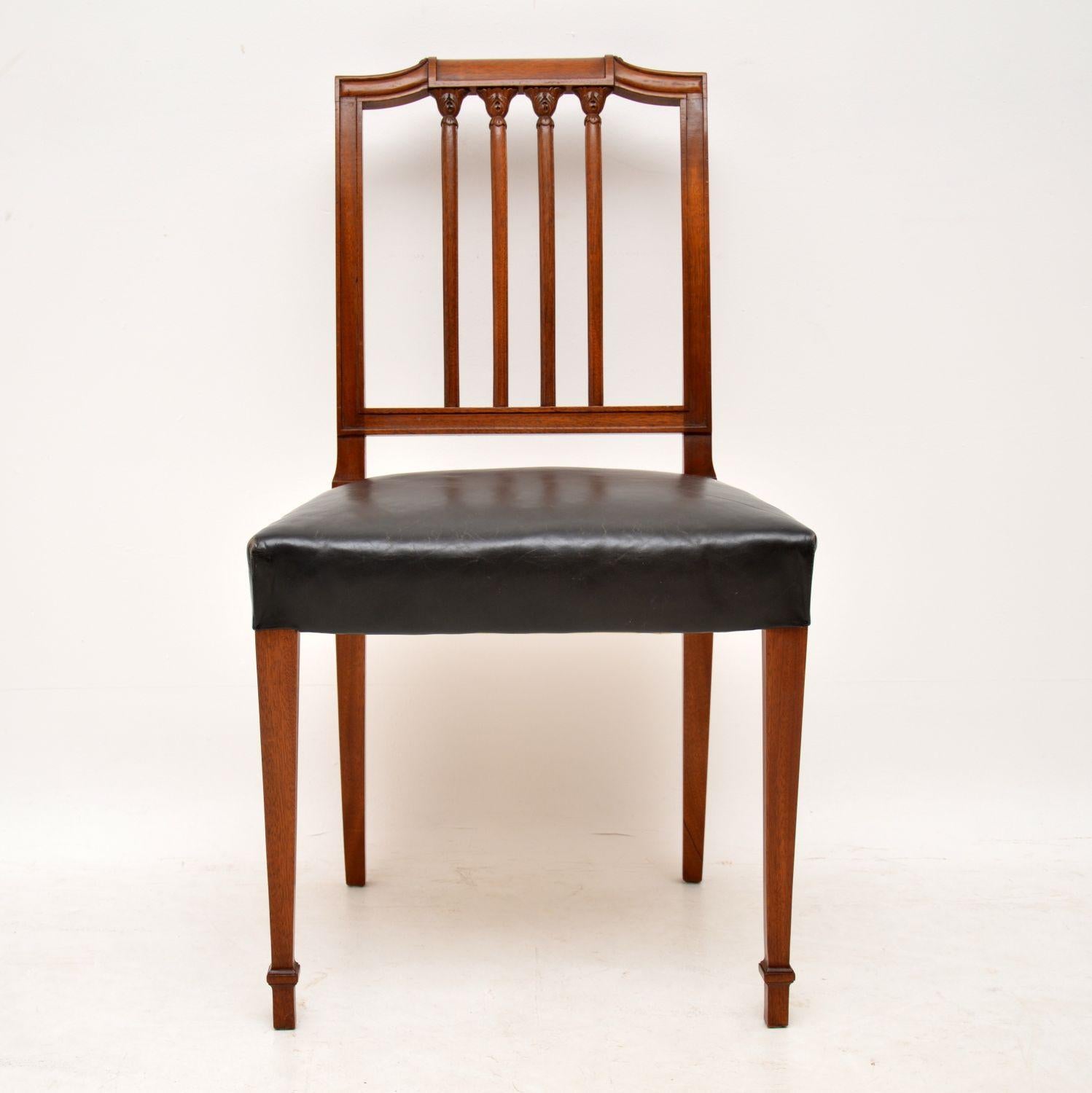 Nice quality set of four antique Georgian style mahogany dining chairs dating from circa 1910 period. They are in good condition and have sprung leather seats which may be original. The leather is still in good condition and I think the black