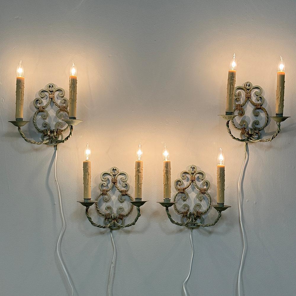 Set of Four Antique Painted Wrought Iron Electrified Wall Sconces are ideal for adding a rustic charm to any room, stairwell, hallway, bathroom ~ you name it!  Having two pair available increases your design options.  The mirror image scrollwork of