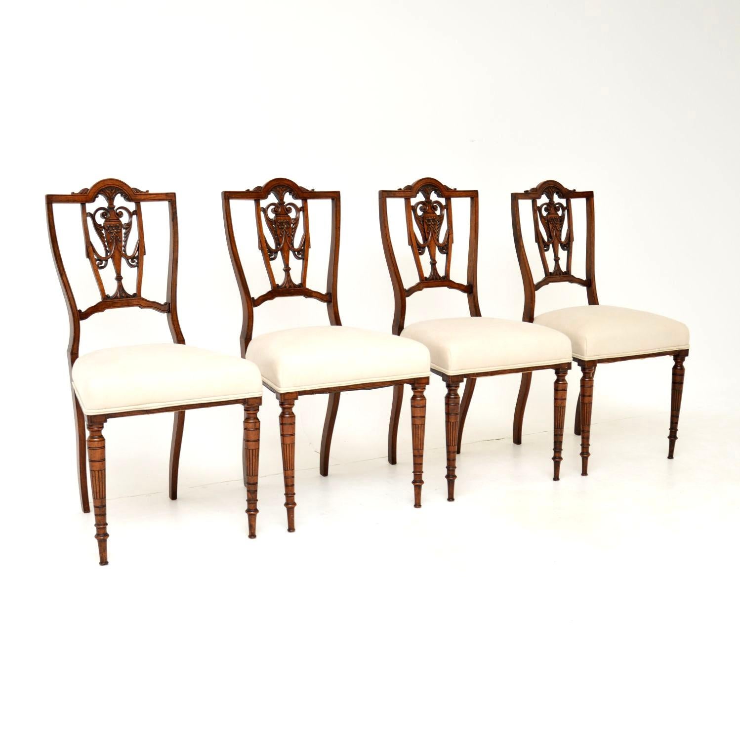 A beautiful and elegant set of four antique Victorian dining chairs. These were made in England, they date from around the 1880-1900 period.

They have a gorgeous design, with fine carving on the backs and beautifully turned legs. The quality is