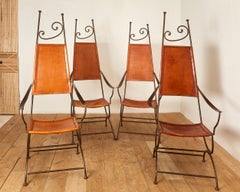 Set of four arcmchairs in the style of Thévenin, iron, circa 1980, France.