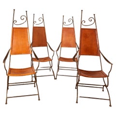 Set of four arcmchairs in the style of Thévenin, iron, circa 1980, France.