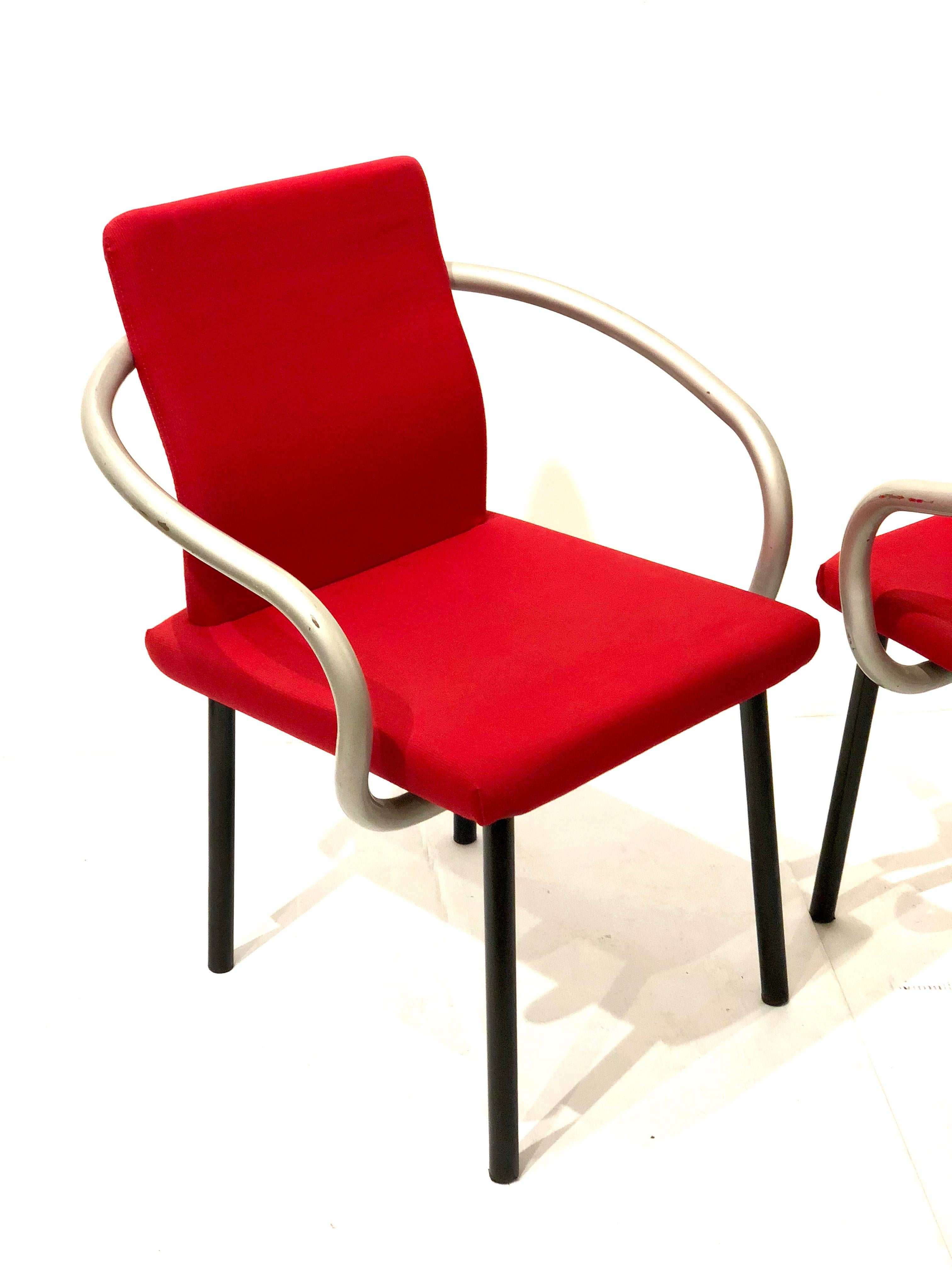 Nice set of four Mandarin chairs designed by Sottsass for Knoll, in red fabric on foam black enameled tubular legs and silver pipping arms, simple and elegant by this master architect.