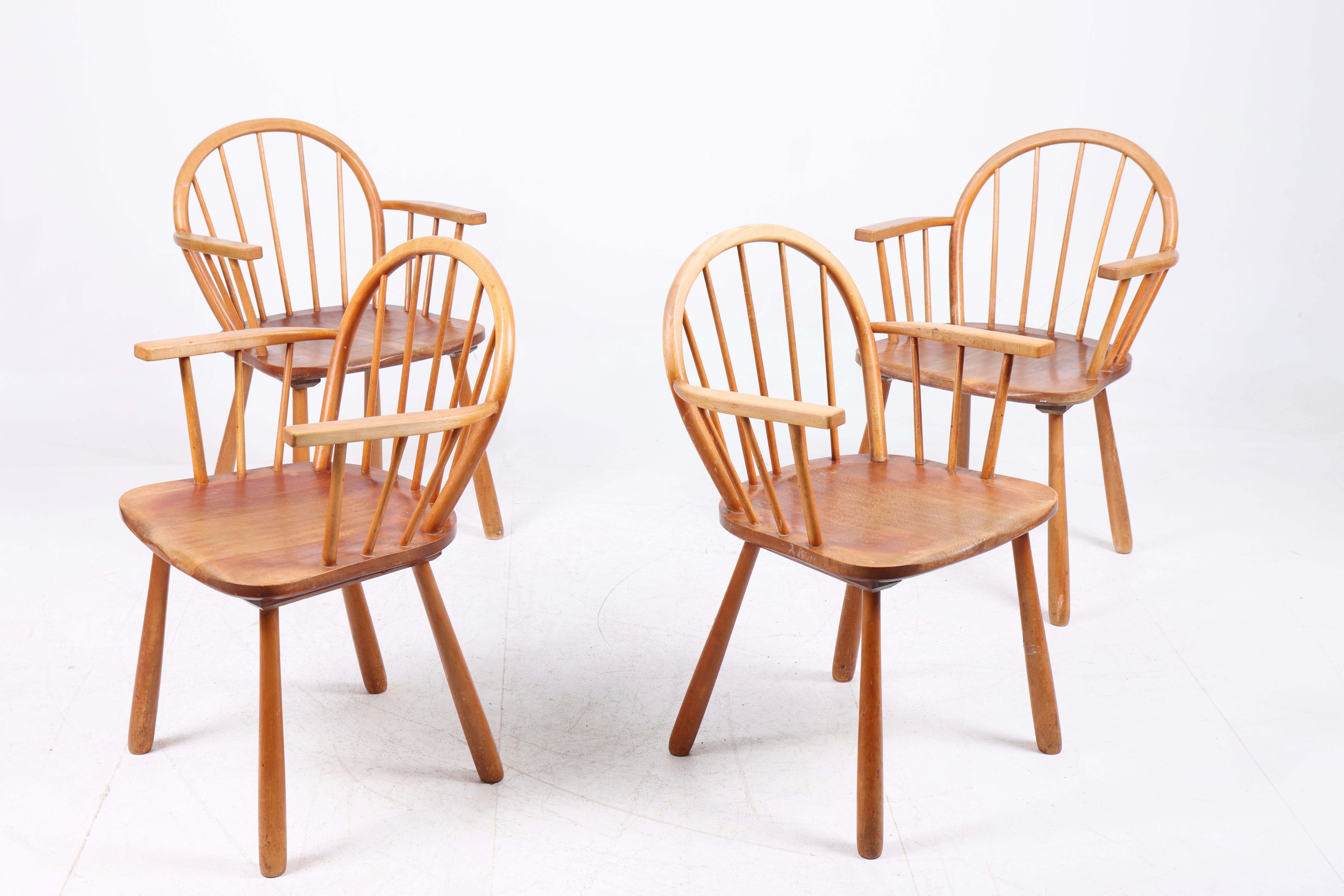 Set of four armchairs in beech designed and made by cabinetmaker Fritz Hansen in the 1940s.