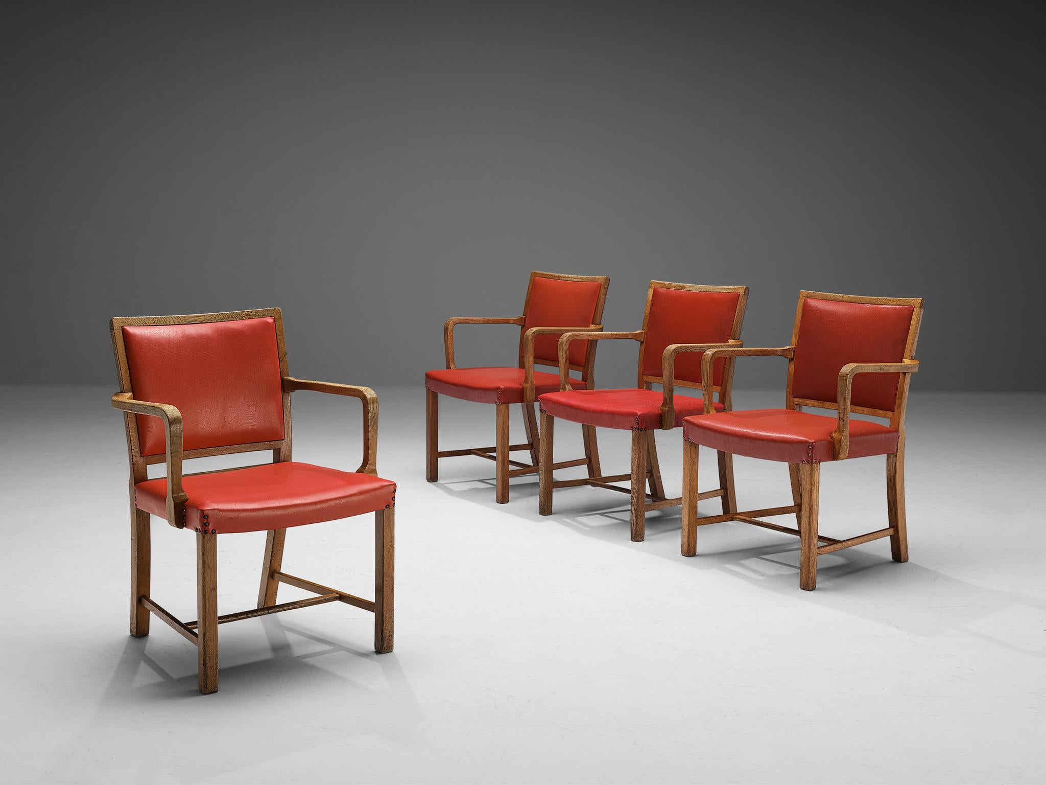 Set of four armchairs, leatherette, oak, brass, Europe, 1950s.

Set of four chairs made in Europe in the 1950s. This set of armchairs display a wide seat with a characteristic, sculptural frame. The titled legs with sharp edges create an overall