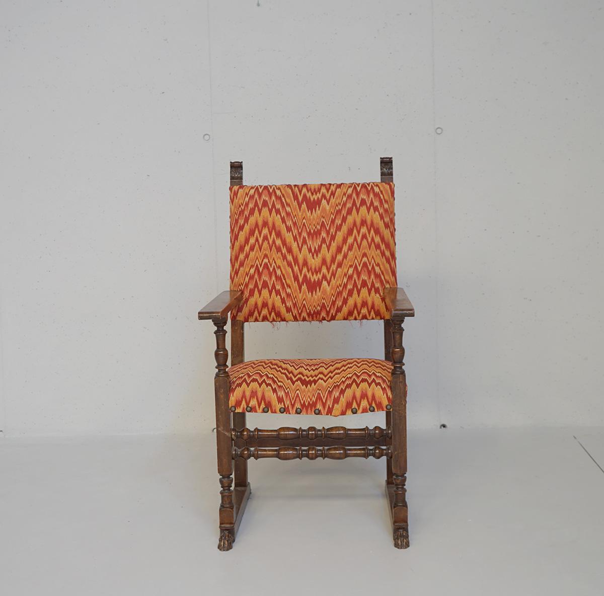 Set of four armchairs of the late 1800 in the style of the sixteenth century. The armchairs are mede in solid walnut, with straight armrest and all round turned spool sleepers. The feet are cantilevered with a lion’s foot decoration. They feature a