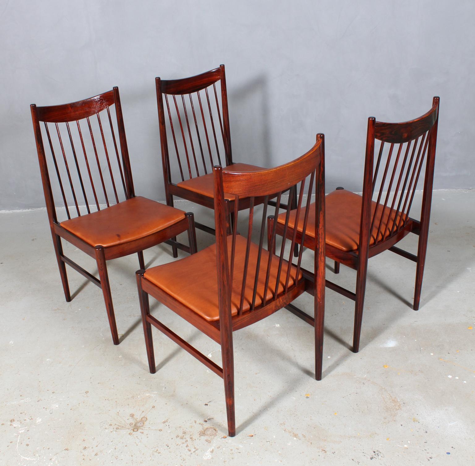 Set of six Arne Vodder chairs new upholstered with tan aniline leather.

Frame in partly solid rosewood.

Model 422, made by Sibast.