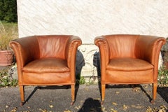 Ensemble de quatre fauteuils club en forme de tonneau Art Déco