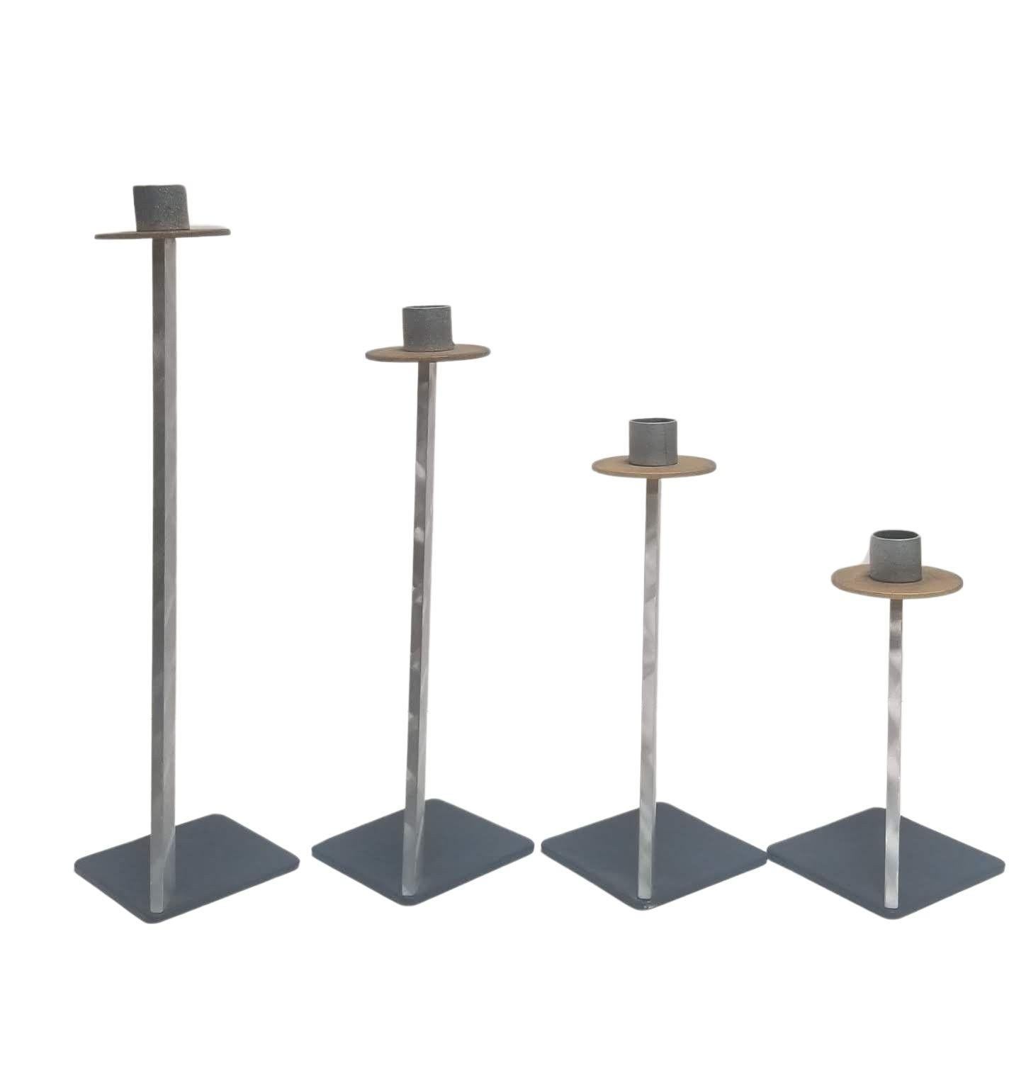 Bruce MacDonald brand, a signature design line curated by the renowned designer himself. The four holders gradually decrease in height, creating a dynamic visual display when arranged together. This tiered design enhances versatility, allowing you