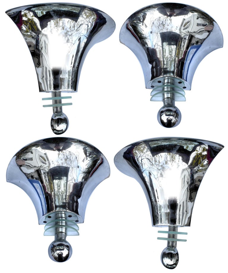 Superb set of four Art Deco wall lights. A chrome globe leads to two glass demi-rondelles which in turn lead to a large chrome trumpet which forms the up-lighter shade. Very simple and very stylish, the photos really don't do them justice. The