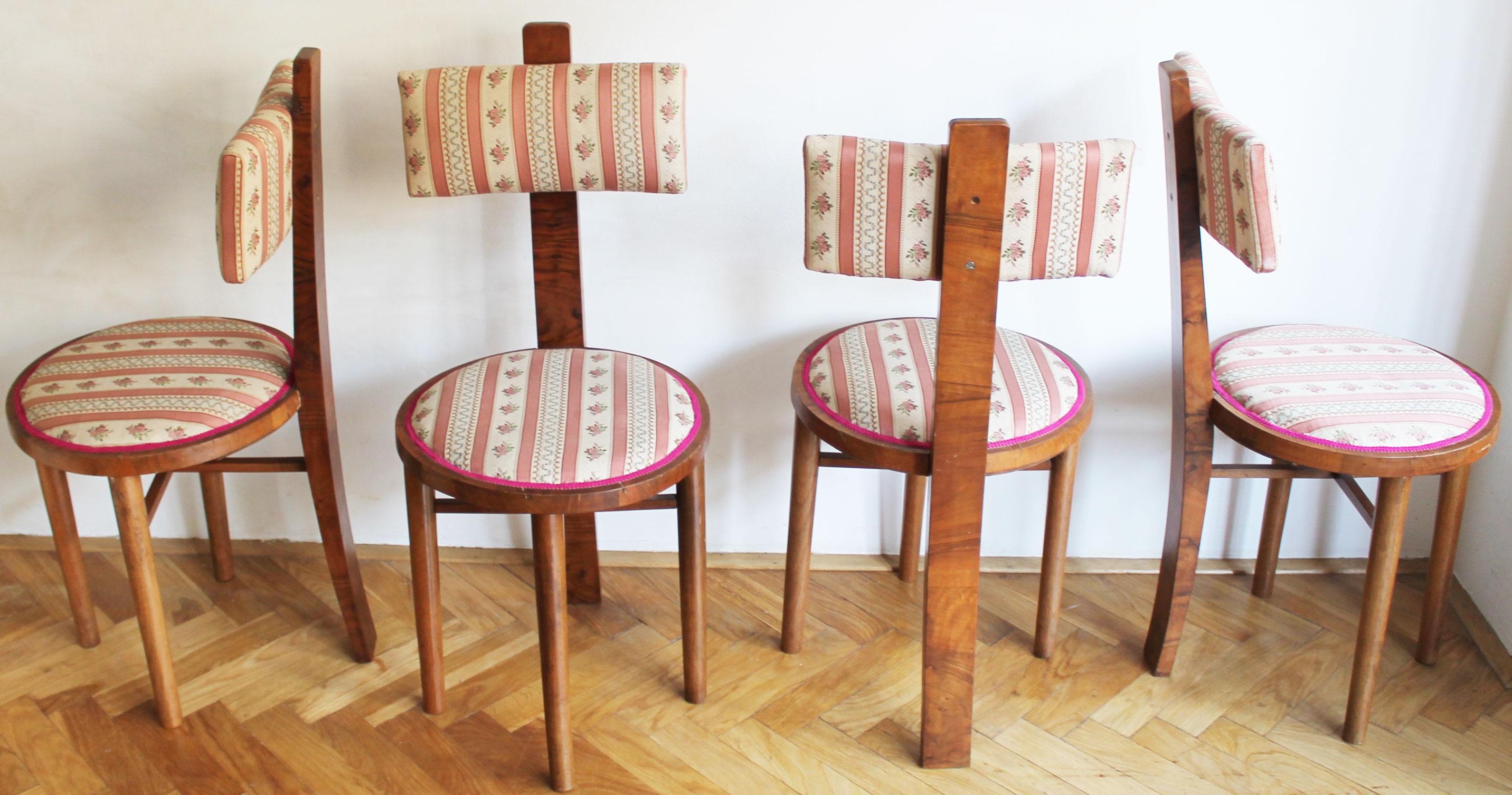 A super rare set of four Art Deco chairs, believed to be designed in the 1910’s. Their design is very original and unusual, especially in the playful design of the back leg connecting to the round seat before continuing up to effortlessly hold the