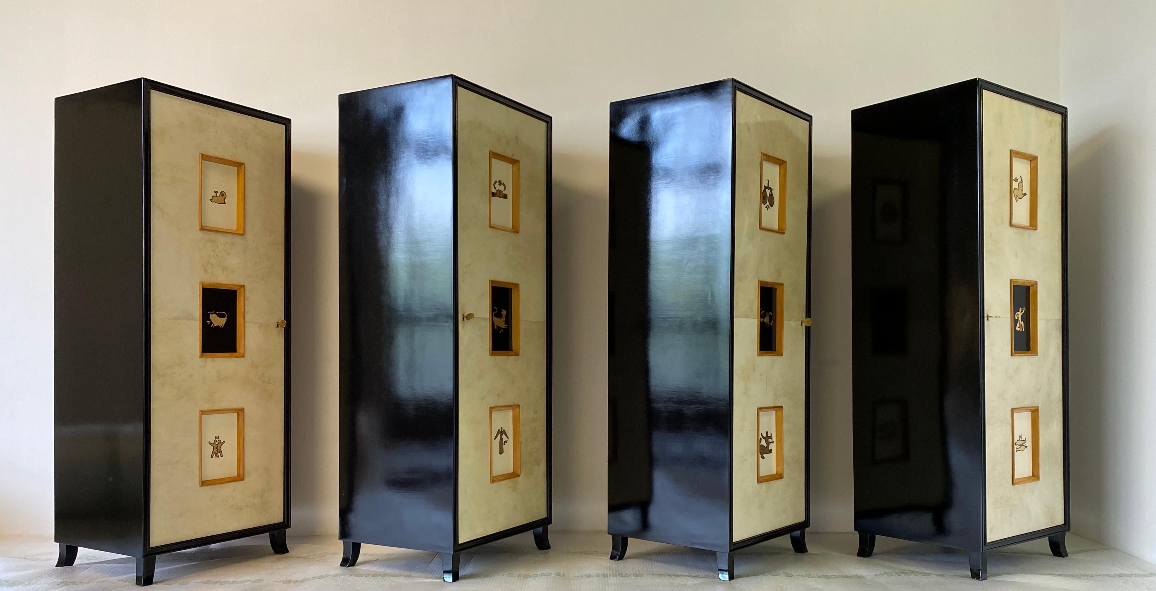 This rare set of four parchment cabinets was produced in the 1940s in Italy.
The front is covered in parchment while the structure is black lacquered.
The central decorations represent the 12 zodiac signs and are handmade with gold leaf.
The