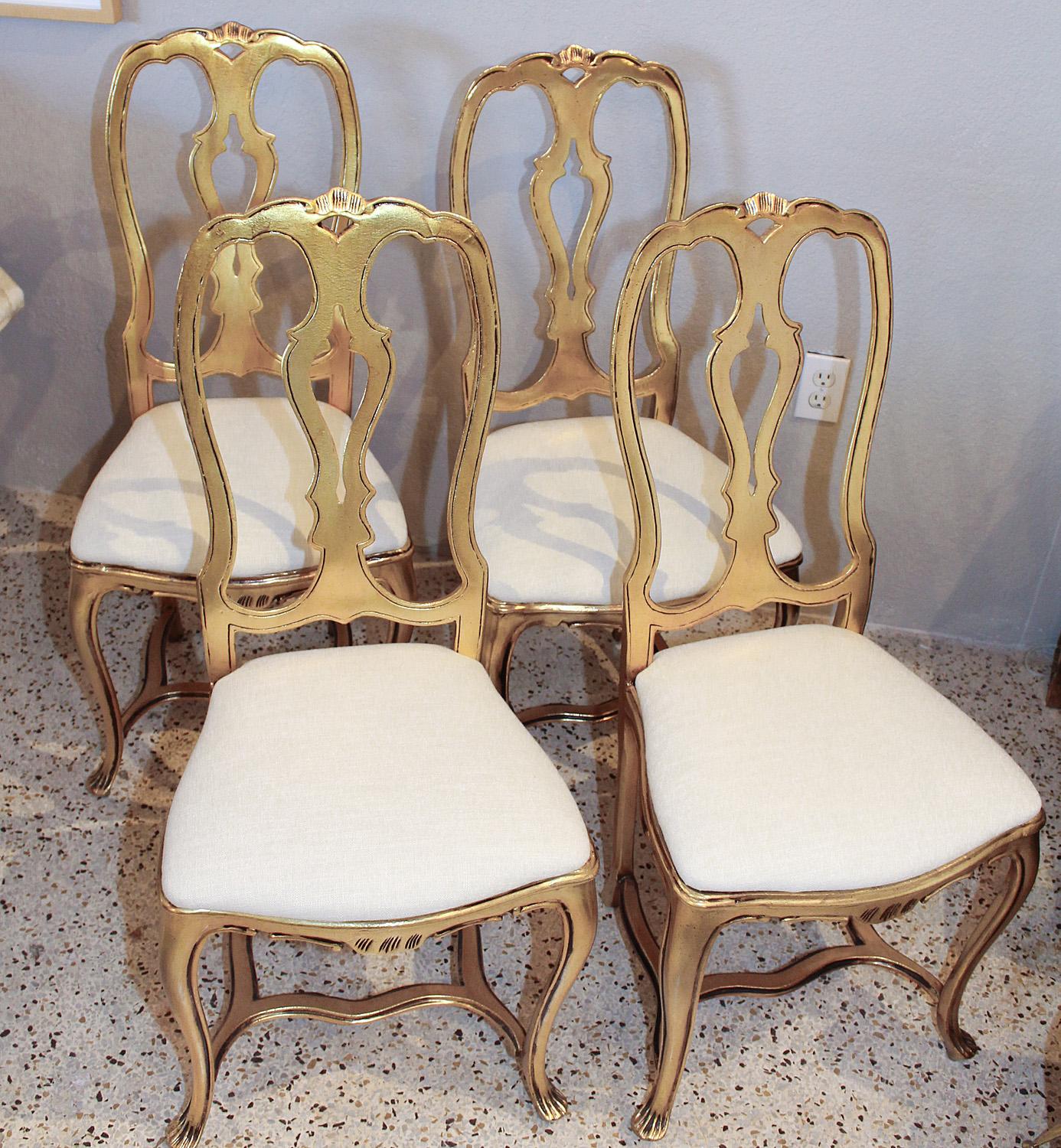 A 1970s take on a traditional form, this newly upholstered set of four Arthur Court gilded aluminum chairs is in near-pristine condition.