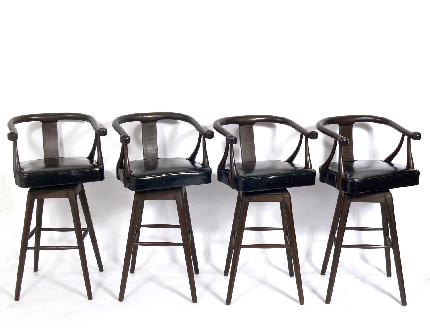 Set of four Asian style midcentury bar stools, circa 1960s. Very reminiscent of the Edward Wormley for Dunbar designed 