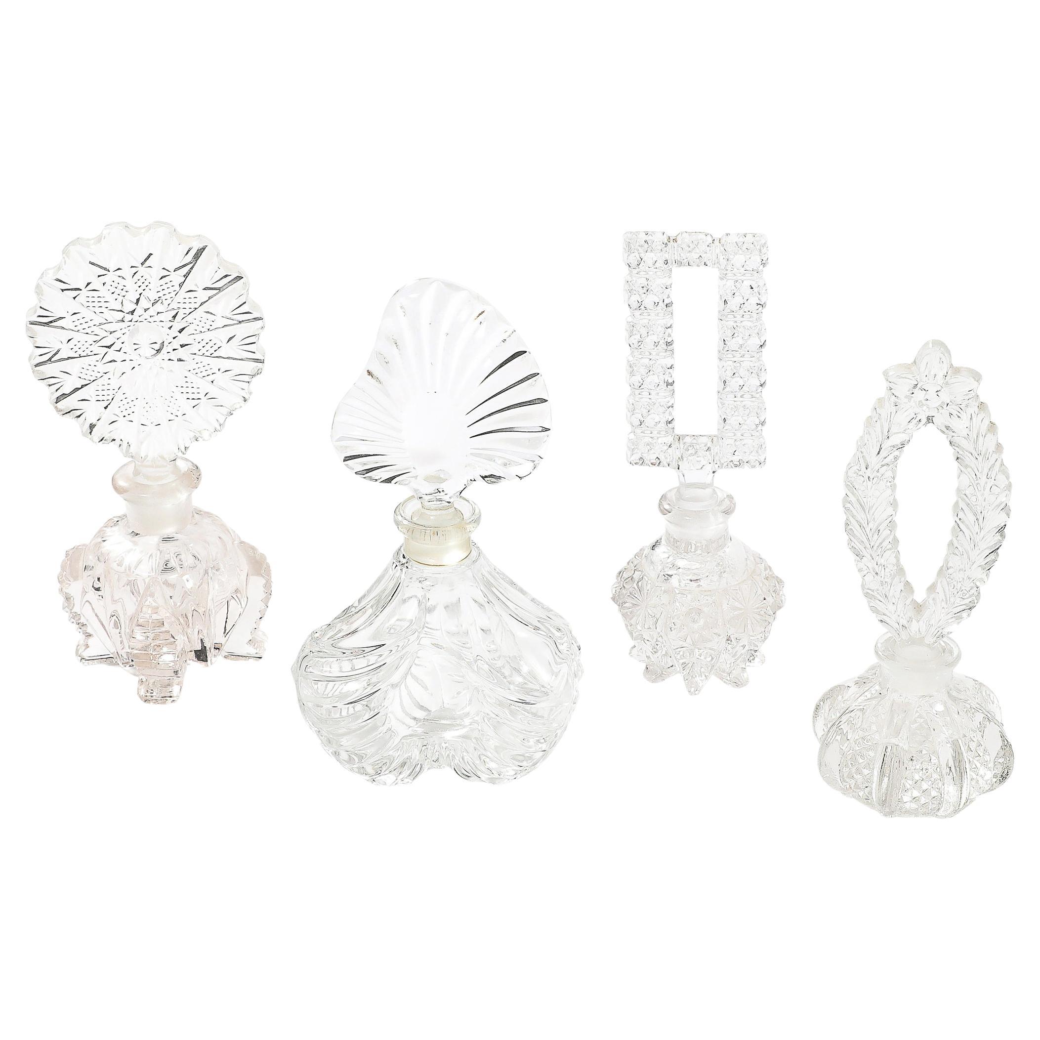 Set di quattro portaprofumi assortiti in vetro pressato Art Déco