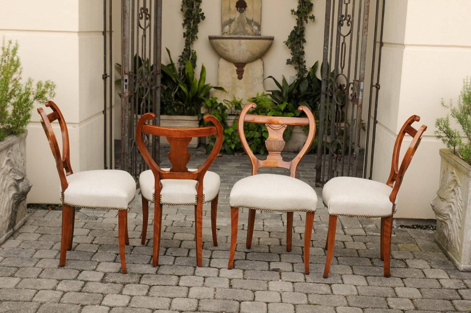 Carved Set of Four Austrian Biedermeier Side Chairs with Lyre Shaped Backs, circa 1850 For Sale