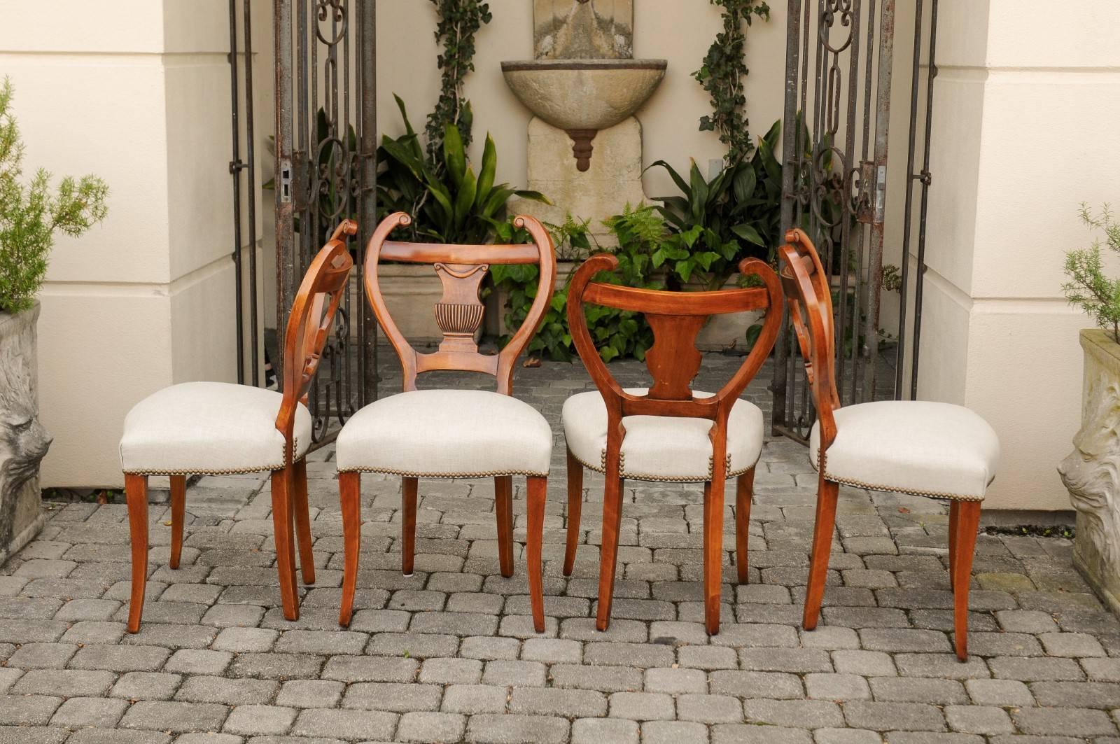 Upholstery Set of Four Austrian Biedermeier Side Chairs with Lyre Shaped Backs, circa 1850 For Sale