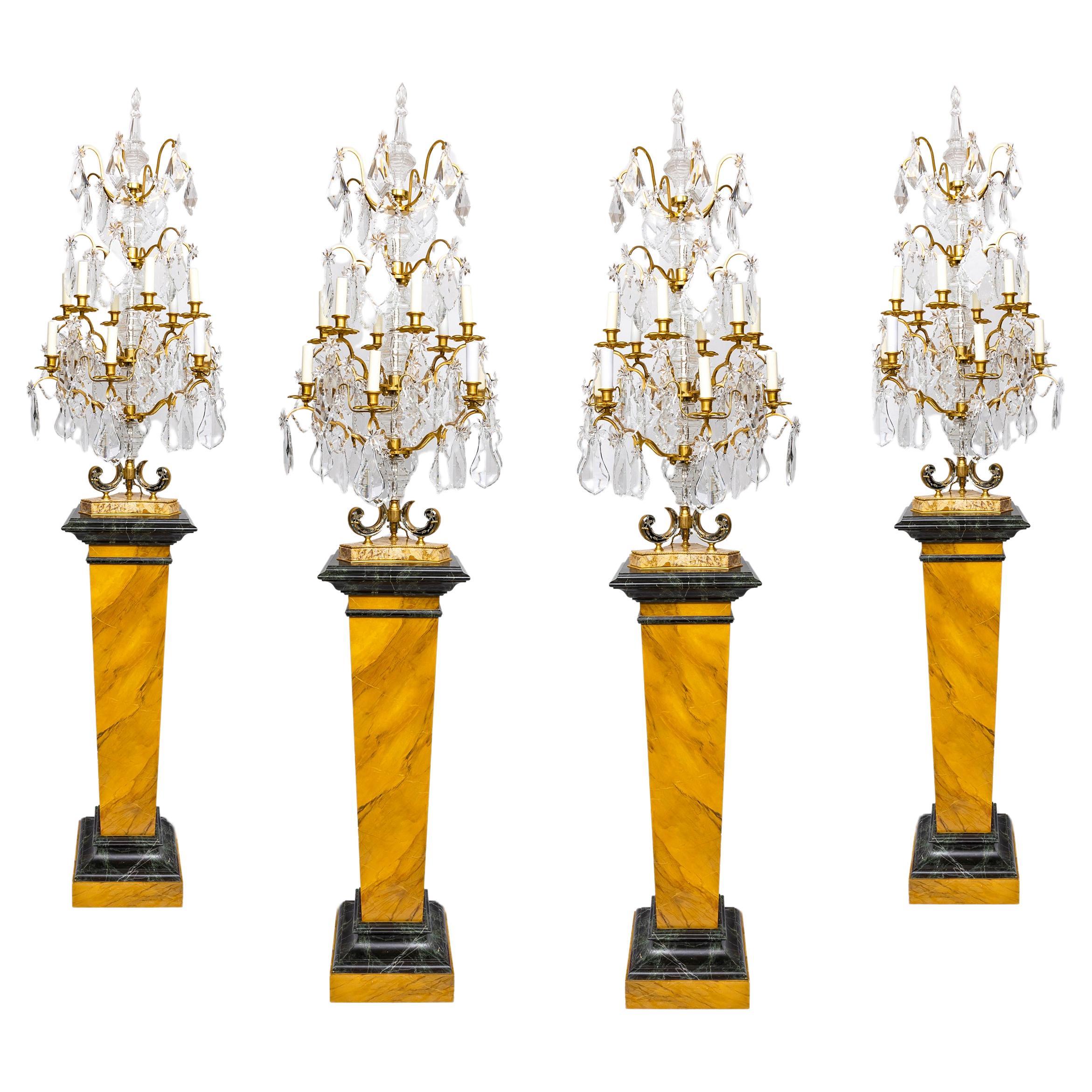 Deux paires de girandoles en cristal sur piédestaux attribuées à la Maison Jansen Paris en vente
