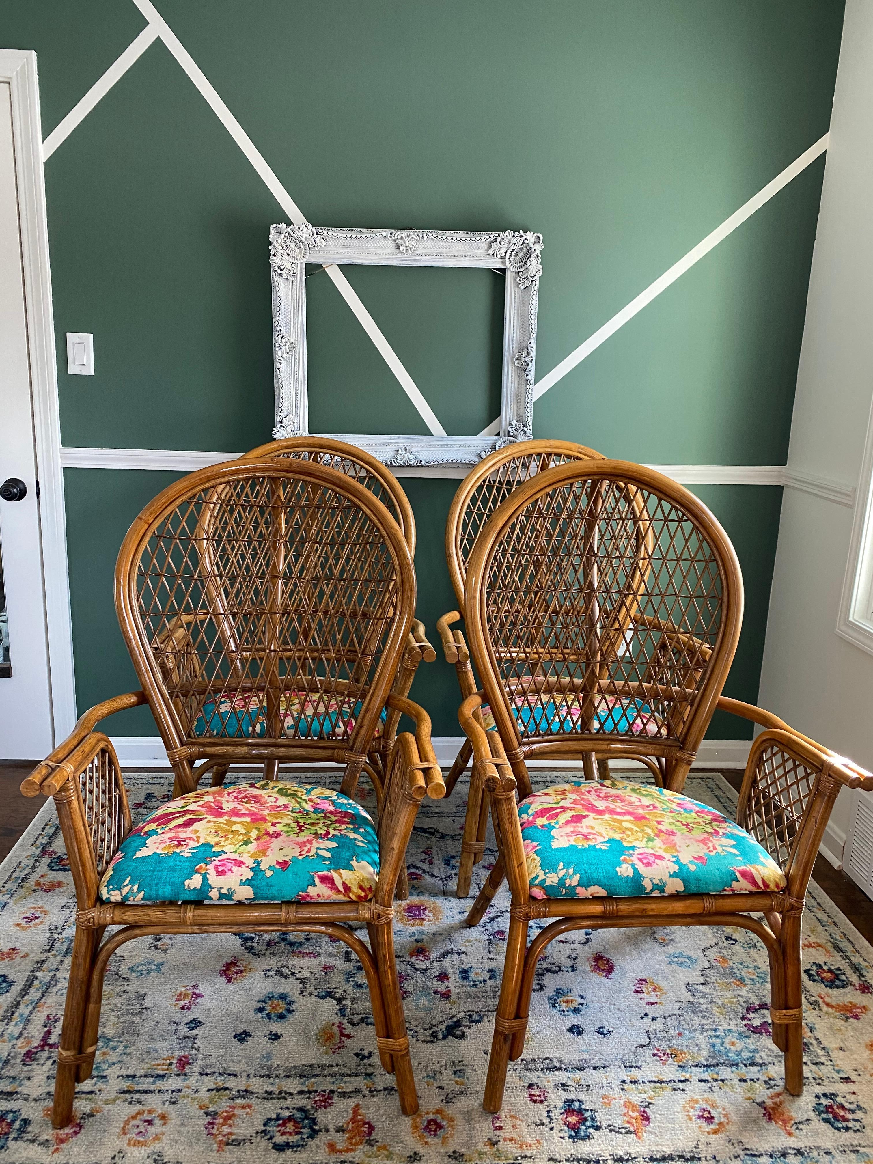 Beautiful set of four reupholstered bamboo/rattan Hollywood Regency Peacock outdoor/sunroom dining armchairs. These chairs are very special with wicker backing and arms, along with a beautiful curved back. All chairs are reupholstered in a bright