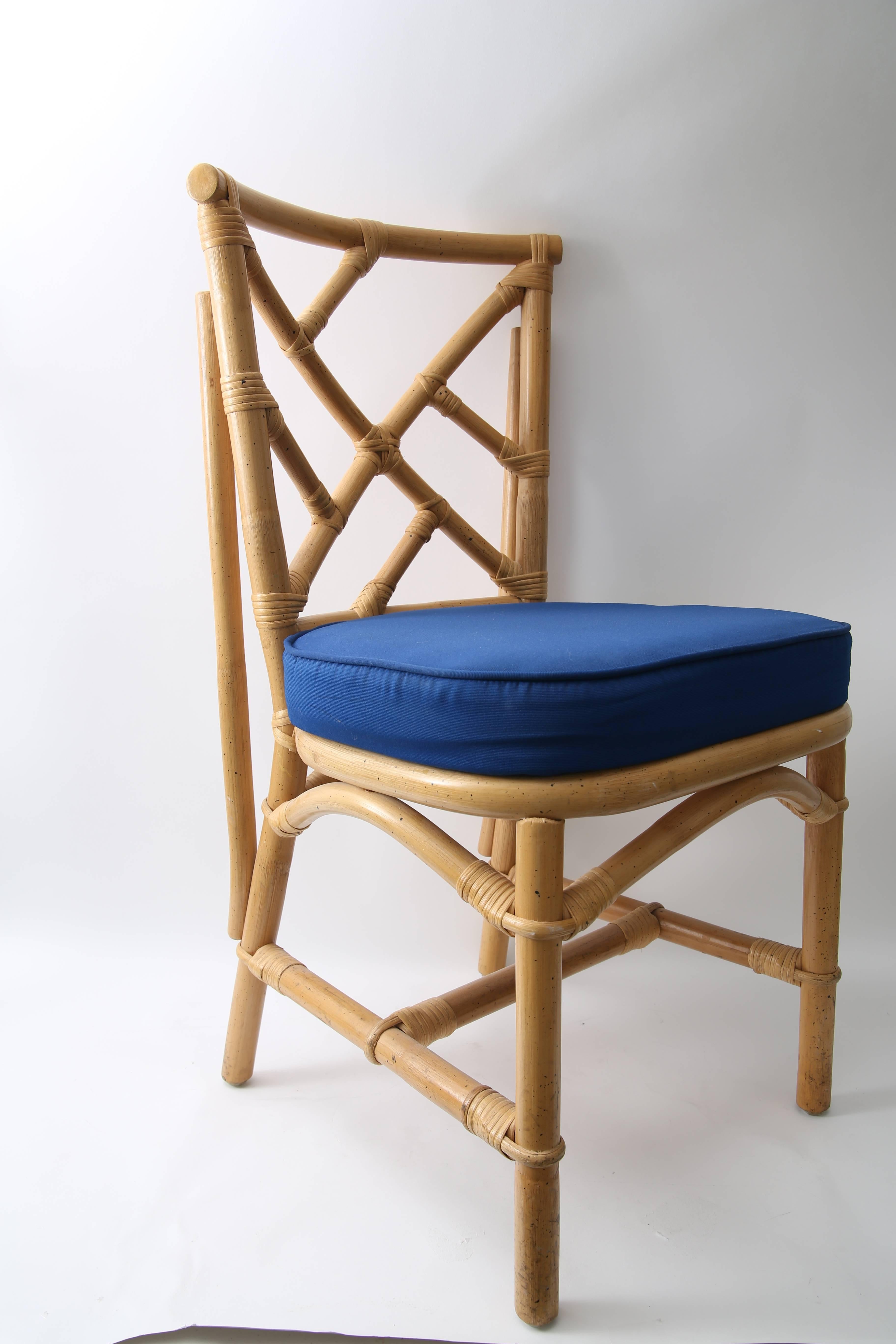 This stylish set of four side chairs are fabricated in bamboo with a fret-work Chippendale pattern and upholstered in a marine blue woven fabric.

Note: We also have the same chairs available in quantities of a ten piece or six piece set.
