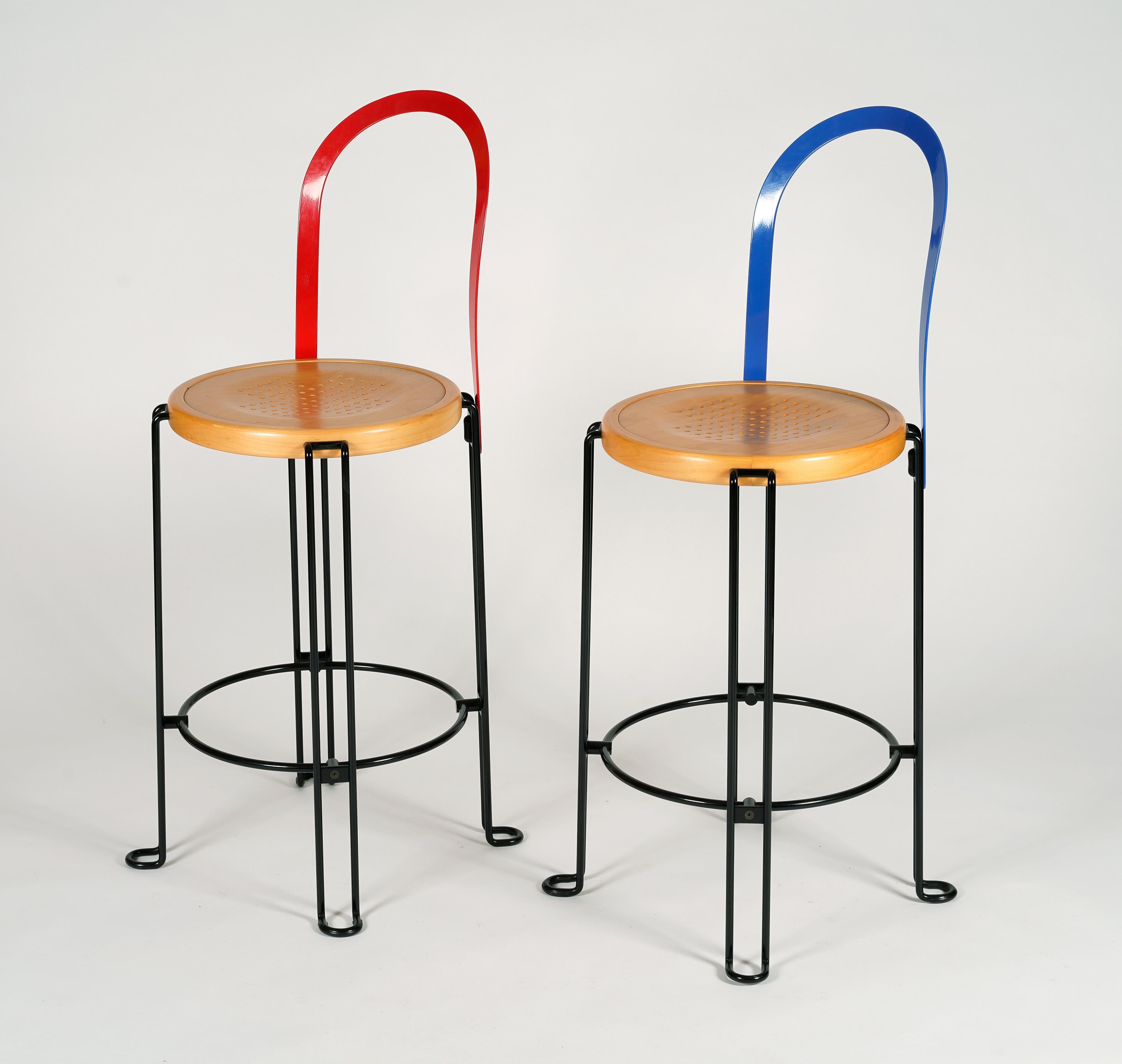Set of four colourful bar stools designed by Börge Lindau for Blå Station. Lacquered steel in blue and red with seats in birch. Produced in Åhus Sweden. This model was designed in 1986.

Good vintage condition with minor marks of usage and age.