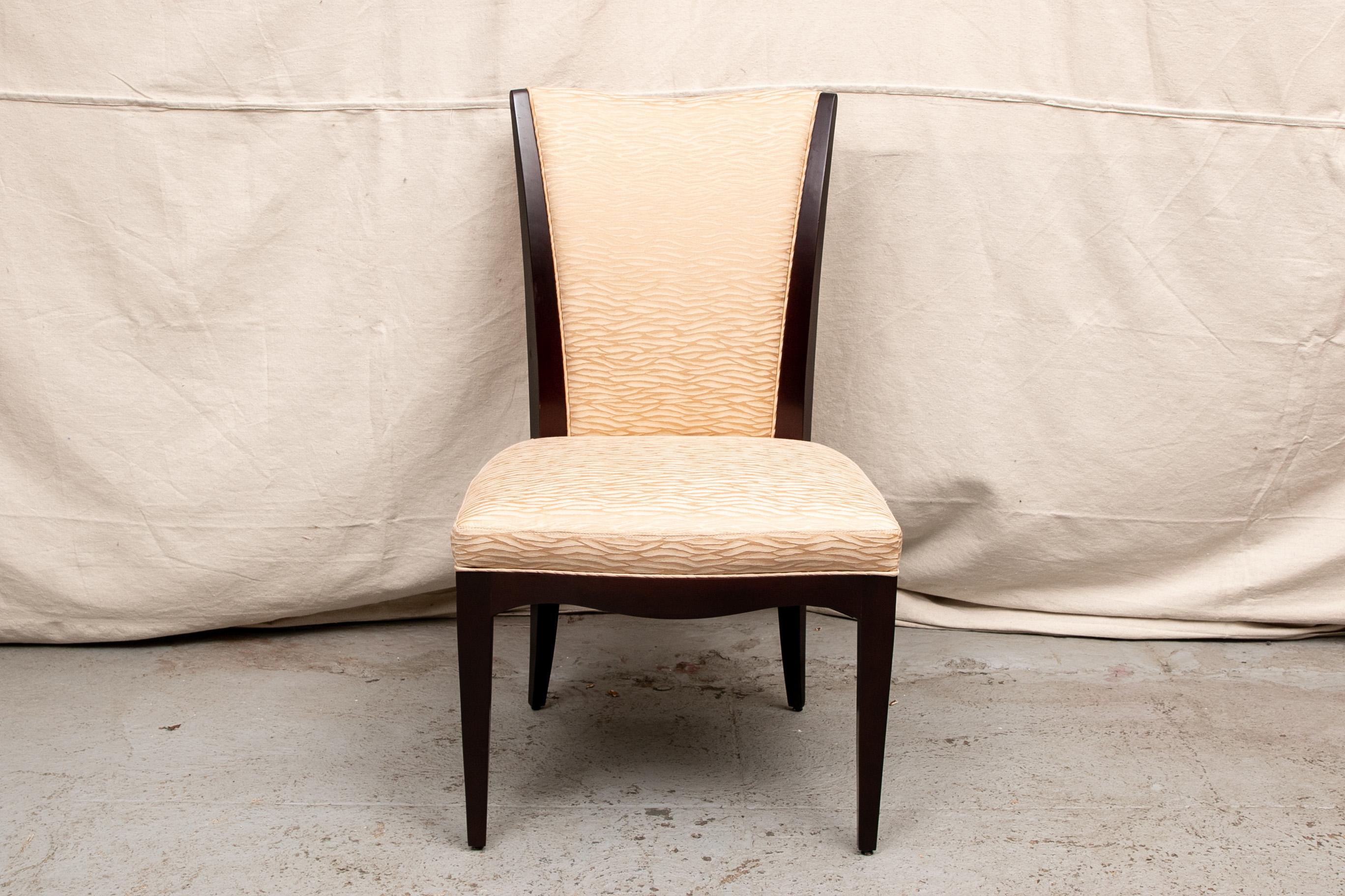 Set of four Barbara Barry for Baker Furniture upholstered side chairs, contrasting peach damask upholstery seat and backrest inset in a mahogany frame, marked on underside with both manufacturer's labels.

Condition: Good condition with light