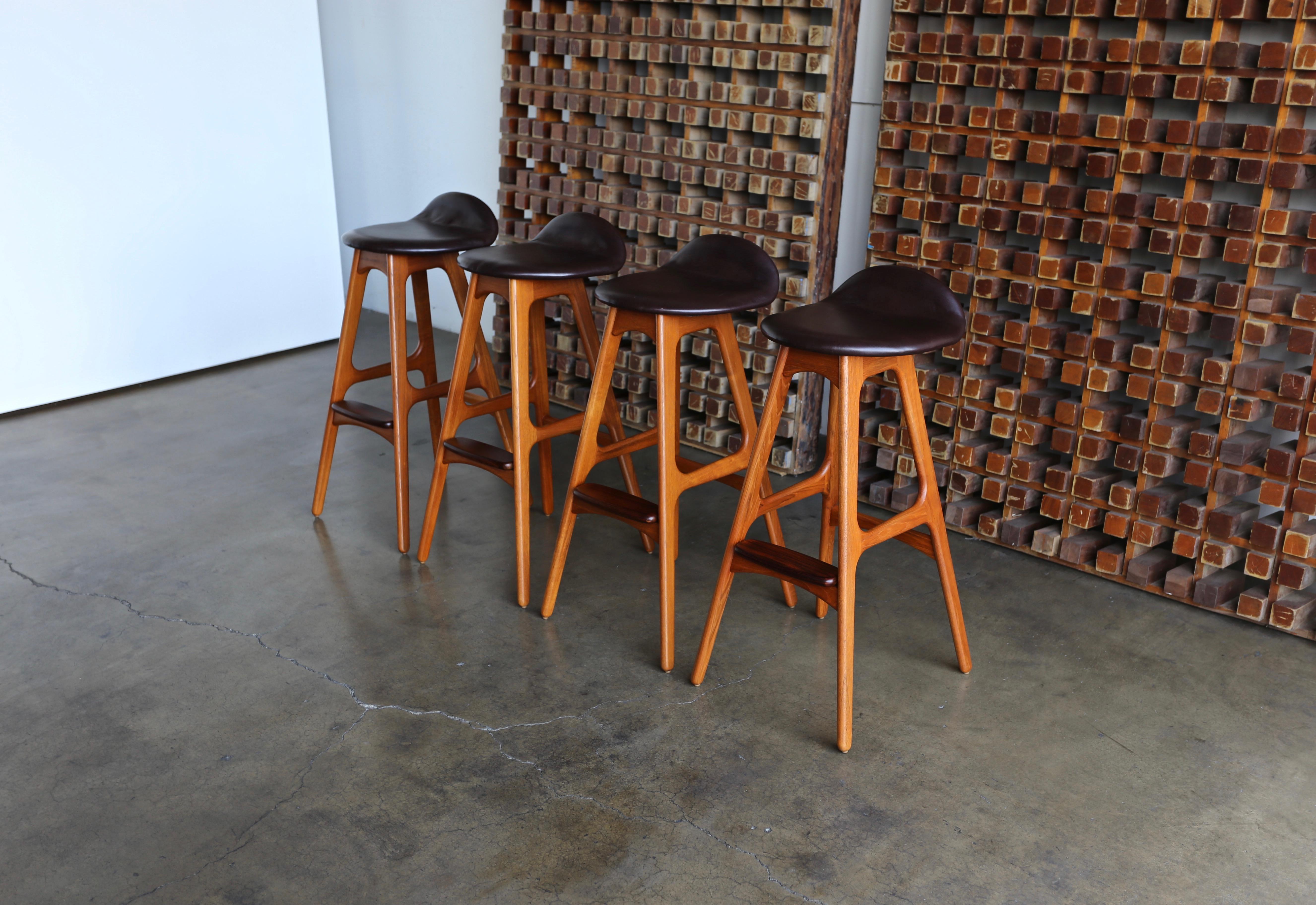 Set of four teak, rosewood & leather barstools by Erik Buch or Erick Buck for O.D. Møbler, Denmark.