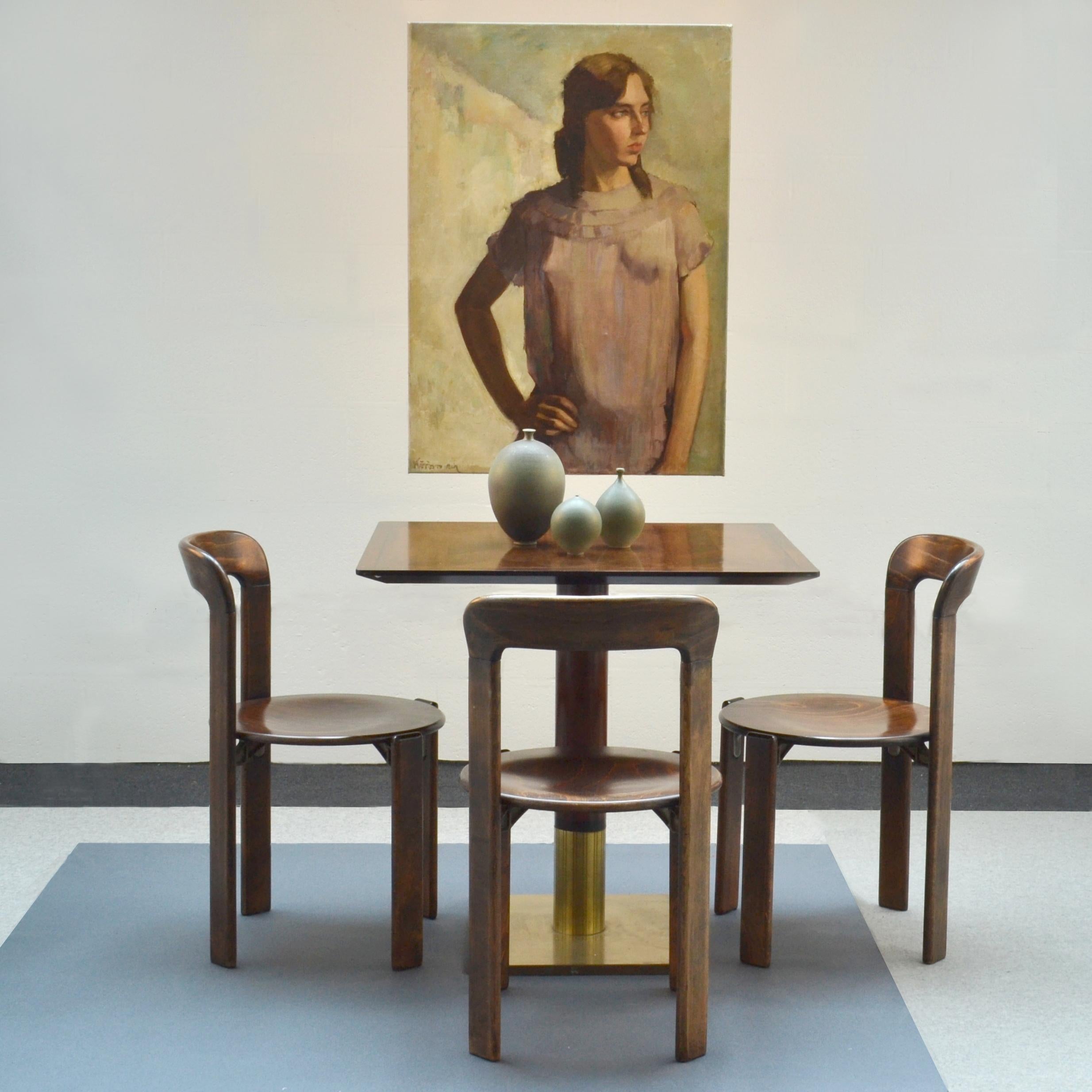 Four dining chairs in the 1970's by Kusch&Co after original functional Bauhaus design by Bruno Rey. They are easy to stack and store away. The construction is very robust with a wood to metal connection between the legs and seat.
   