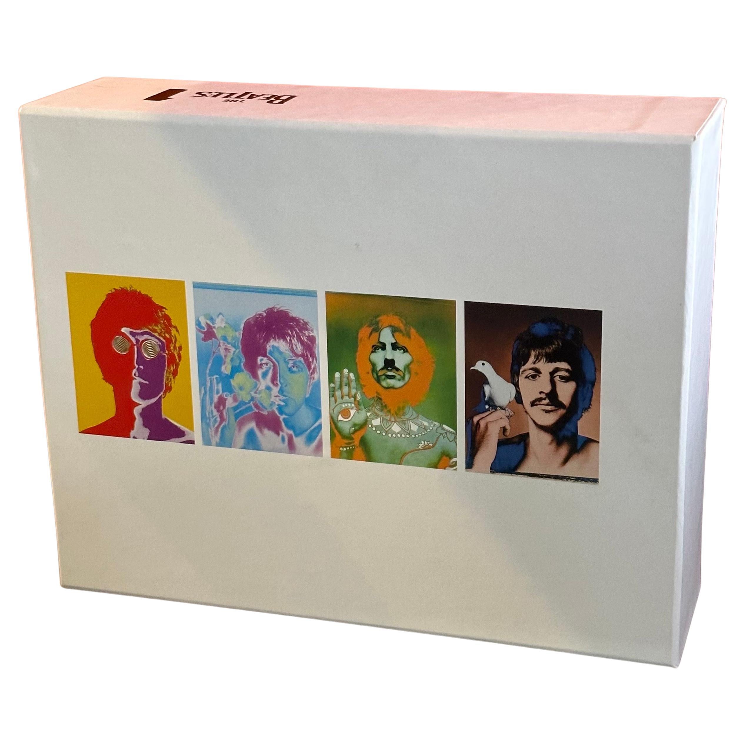 A hard to find set of four psychedelic Beatles t-shirts in box by Richard Avedon, circa 2000s.  The shirts are 100% cotton, size large and are in brand new unused condition.  Each shirt features a different Beatle and uses the images that Avedon