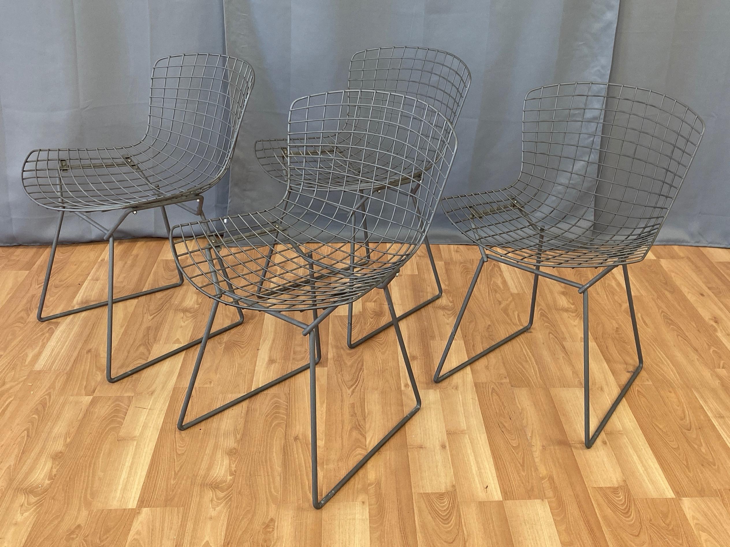 A set of four early 1980s grey 420C side chairs by Harry Bertoia for Knoll.

Released in 1952, this indispensable Mid-Century Modern icon earned Bertoia the 1955 Designer of the Year award, and has proven itself a versatile and durable seating