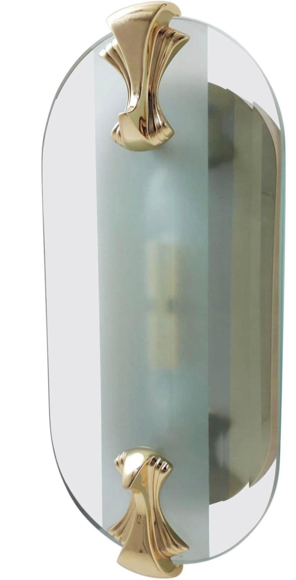 Vintage Set of four Italian wall lights or flush mounts with thick oval beveled glass diffuser mounted on gold plated solid brass frame / Inspired by Fontana Arte, Made by Fratelli Martini / Made in Italy circa 1970s
Height: 21 inches / Width: 10