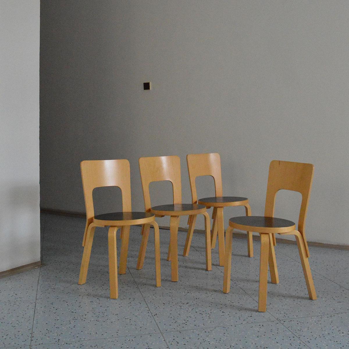 Dining set of four chairs in birch, model 66, designed by Alvar Aalto and manufactured by Artek in Finland, 1980s. 

These chairs are part of the iconic 66 Chair series designed by the renowned Finnish architect and designer Alvar Aalto and