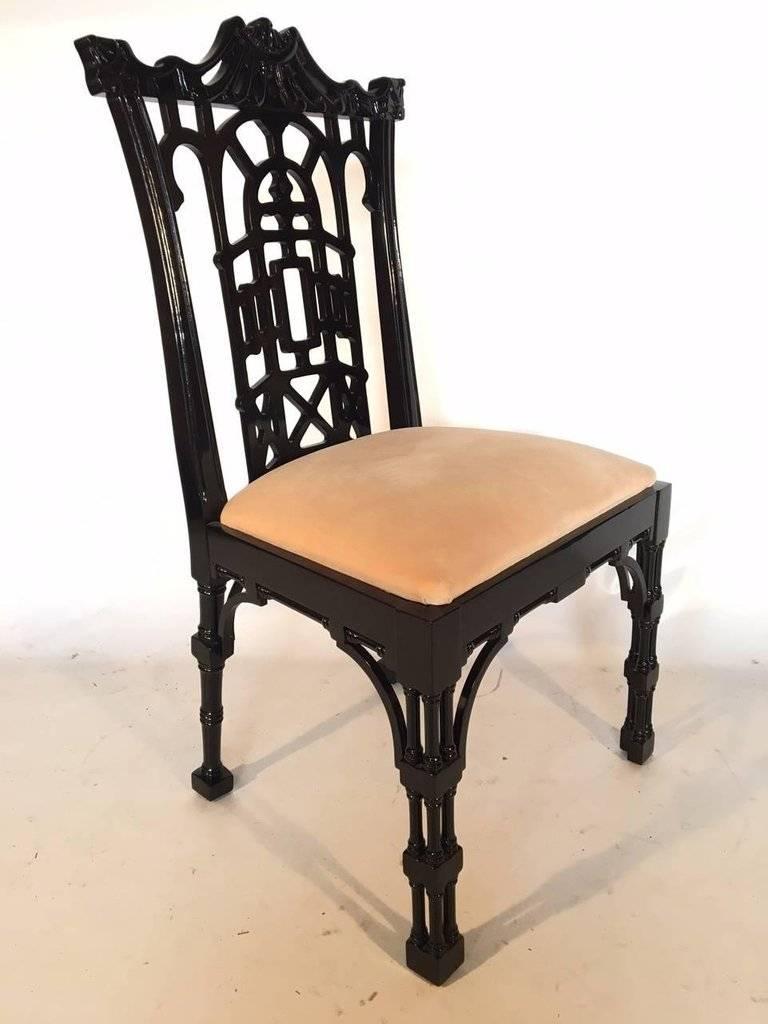 Set of four fabulous Chinese chinoiserie dining chairs in gloss black. Ornate pagoda style detailing and high gloss finish. Made in Valencia, Spain. Makers tag present. Very good vintage condition with minor marks to upholstery. Custom upholstery is
