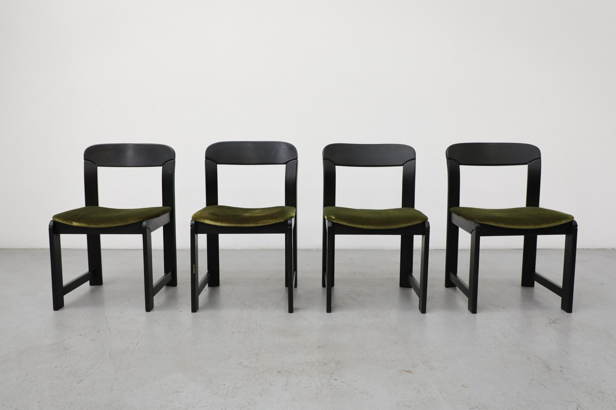 Set of Four vintage dining chairs with a funky, distinctive design that channels the best of 70's glamour and 80s Pomo. The Geometric boldness of Willy Rizzo for Mario Sabot with the rounded, architectural form of Bruno Rey. Black lacquered wood