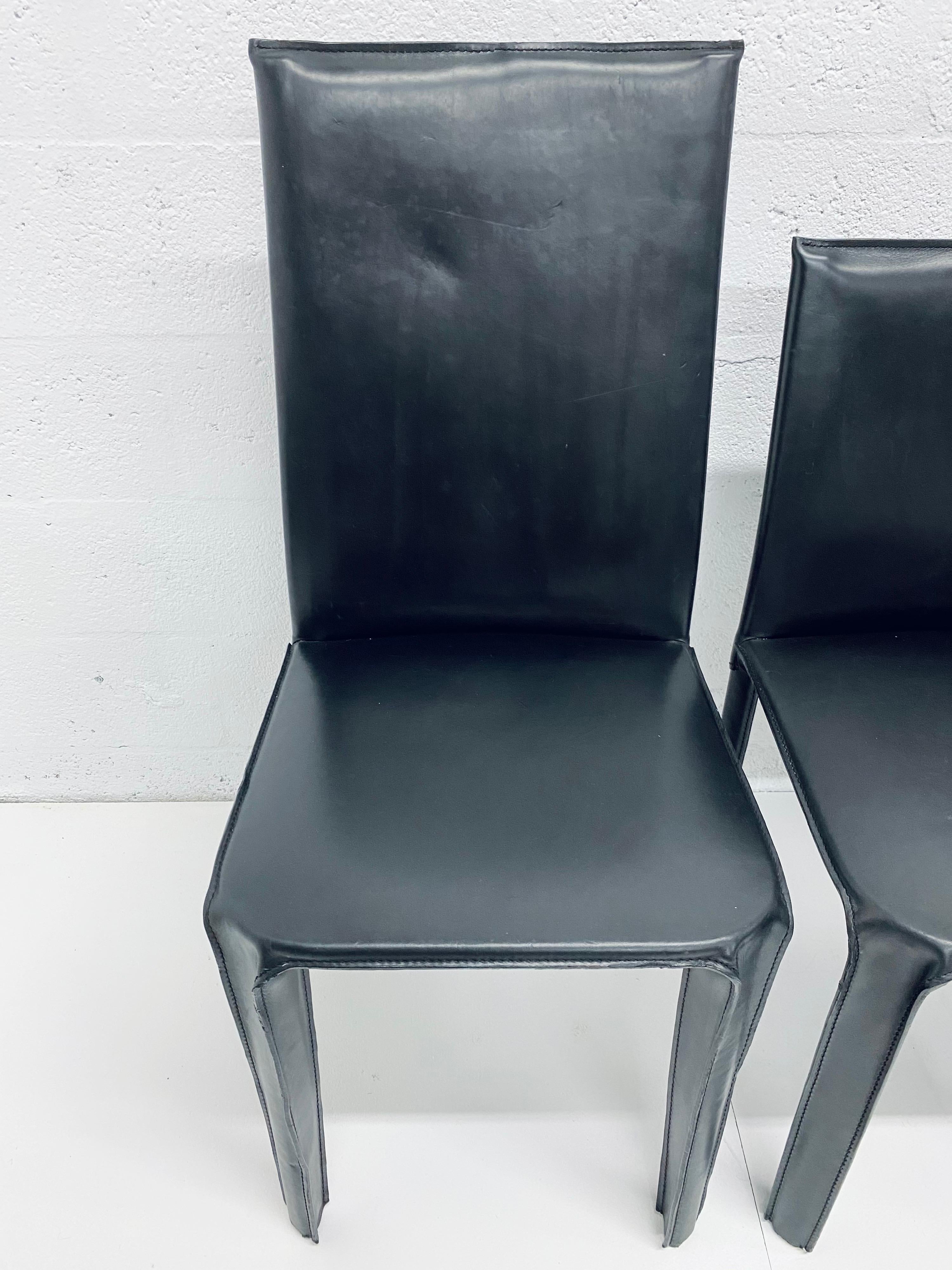 set of four black dining chairs