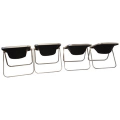 Set of Four Black Leather "Plona" Folding Chairs by Giancarlo Piretti