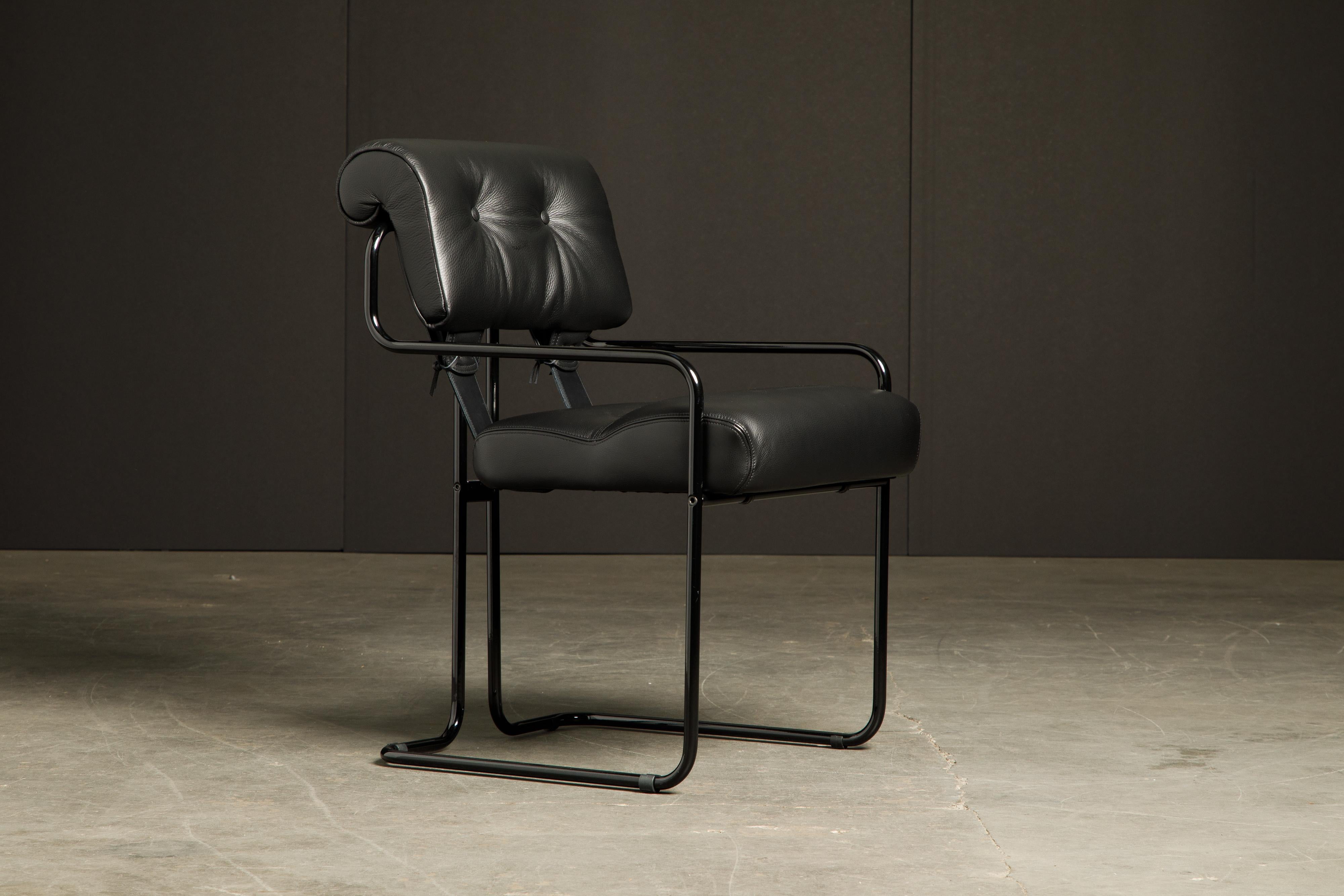Currently, the most coveted dining chairs by interior designers are 'Tucroma' chairs by Guido Faleschini for i4 Mariani, and we have this incredible set of four (4) Tucroma armchairs in beautiful black leather with lacquered black frames. The seats