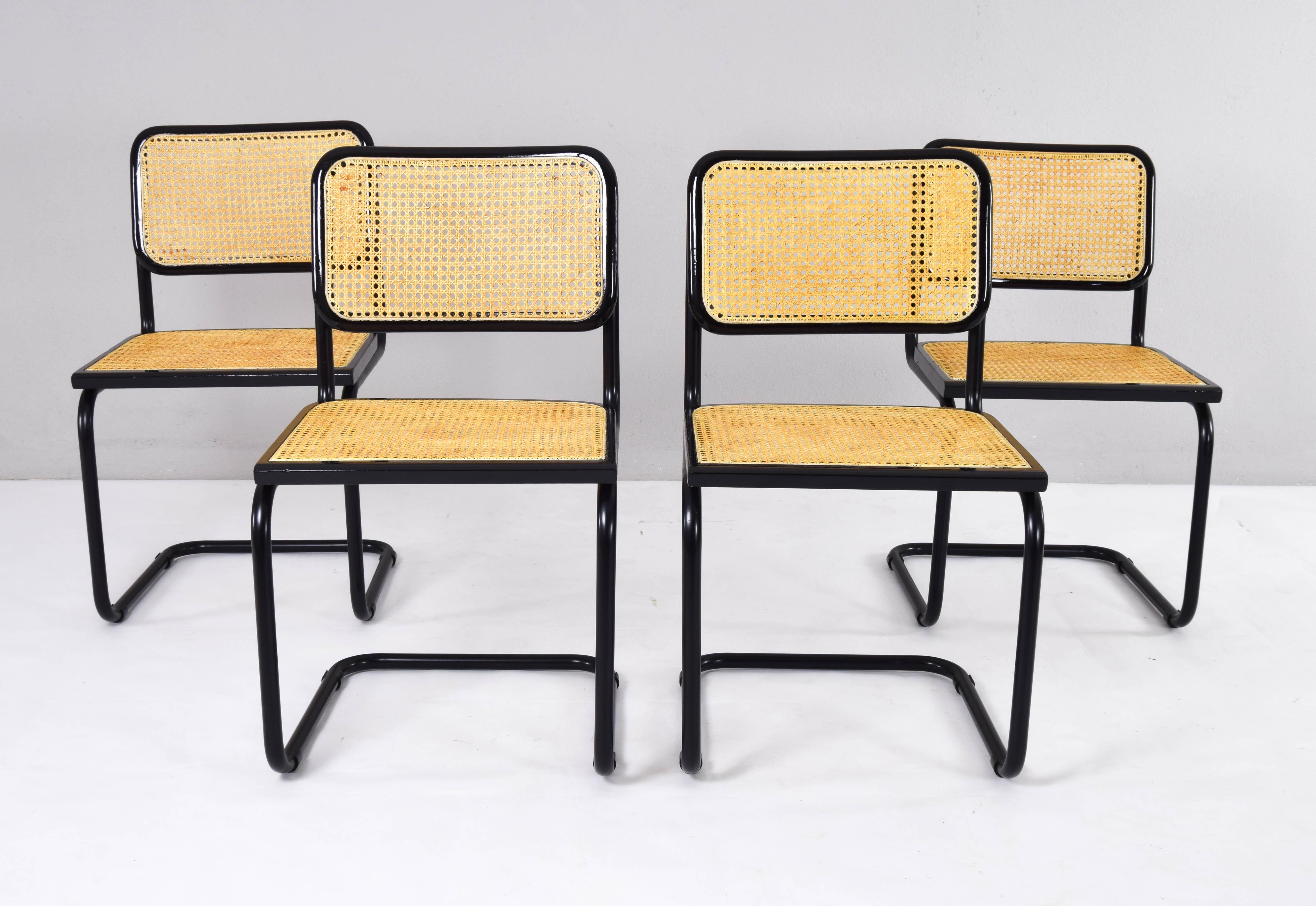 Set of four Cesca chairs, model B32, manufactured in Italy in the 1970s.
Black lacquered tubular structure, beech wood frames lacquered in black and Viennese natural grid.
All the grids have been put in new.
Excellent condition. Chairs restored