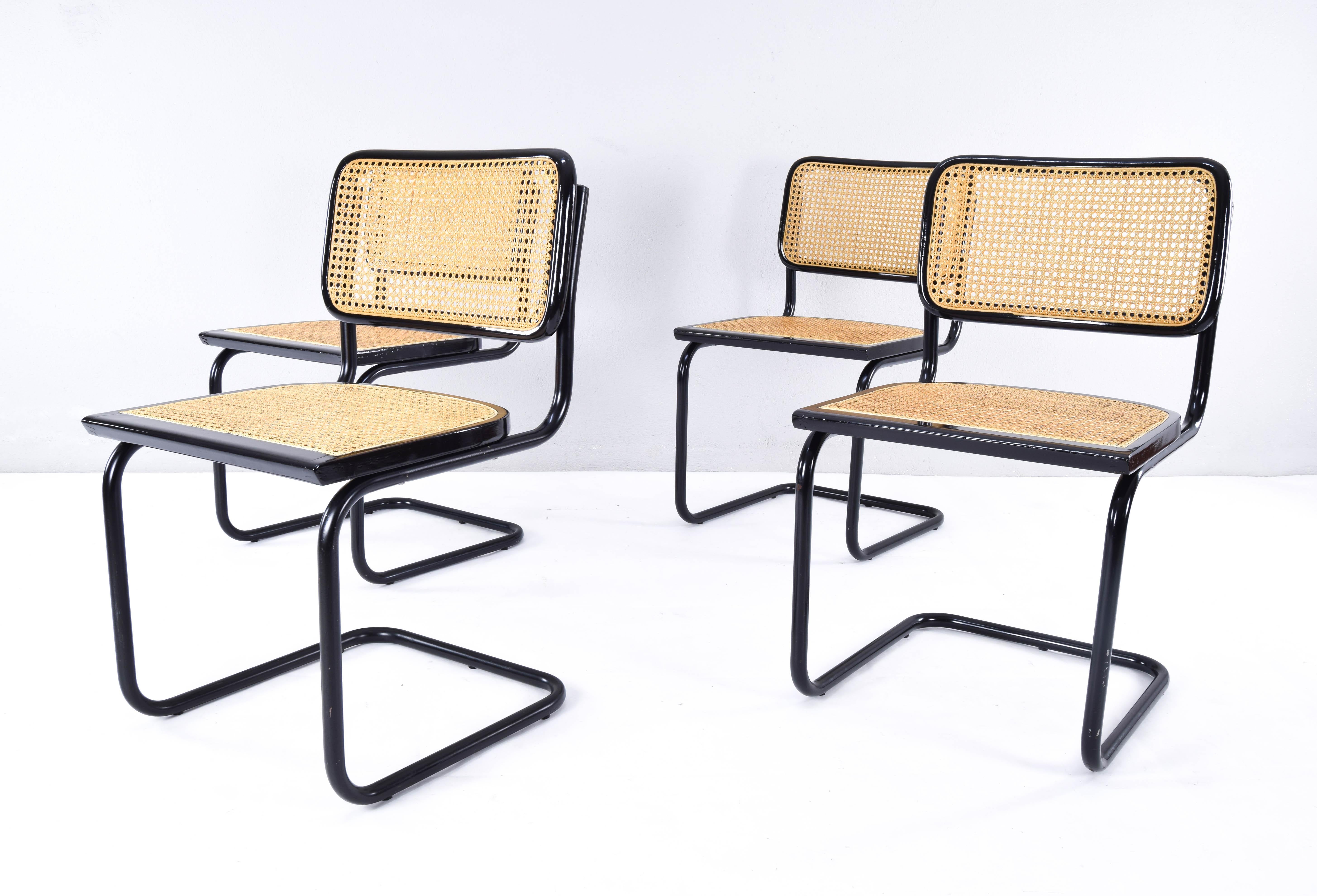 Set of four Cesca chairs, model B32, manufactured in Italy in the 1970s.
Black lacquered tubular structure, beech wood frames lacquered in black and Viennese natural grid.
The grilles on all four seats have been replaced with new