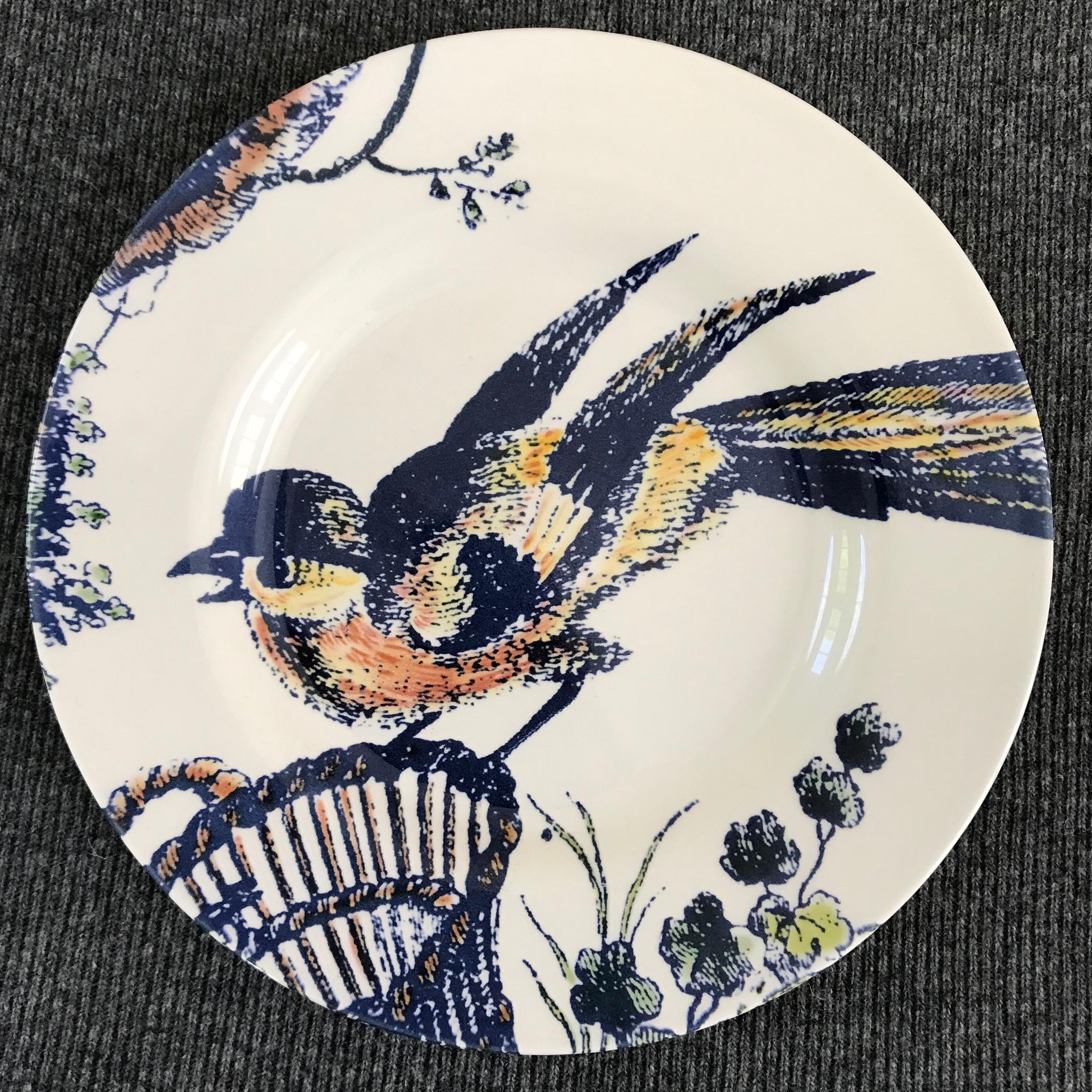 Set of four blue and white bird plates. Four contemporary coloured bird dishes featuring a loon, a rooster, a swan and a kinglet In blues, yellows and peach; a charming avian lunch plate set of four for use or display. Markings for Royal Stafford.