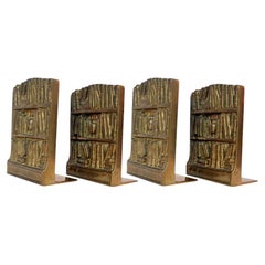 Set of Four Bookends in Bronze with Relief Library Books