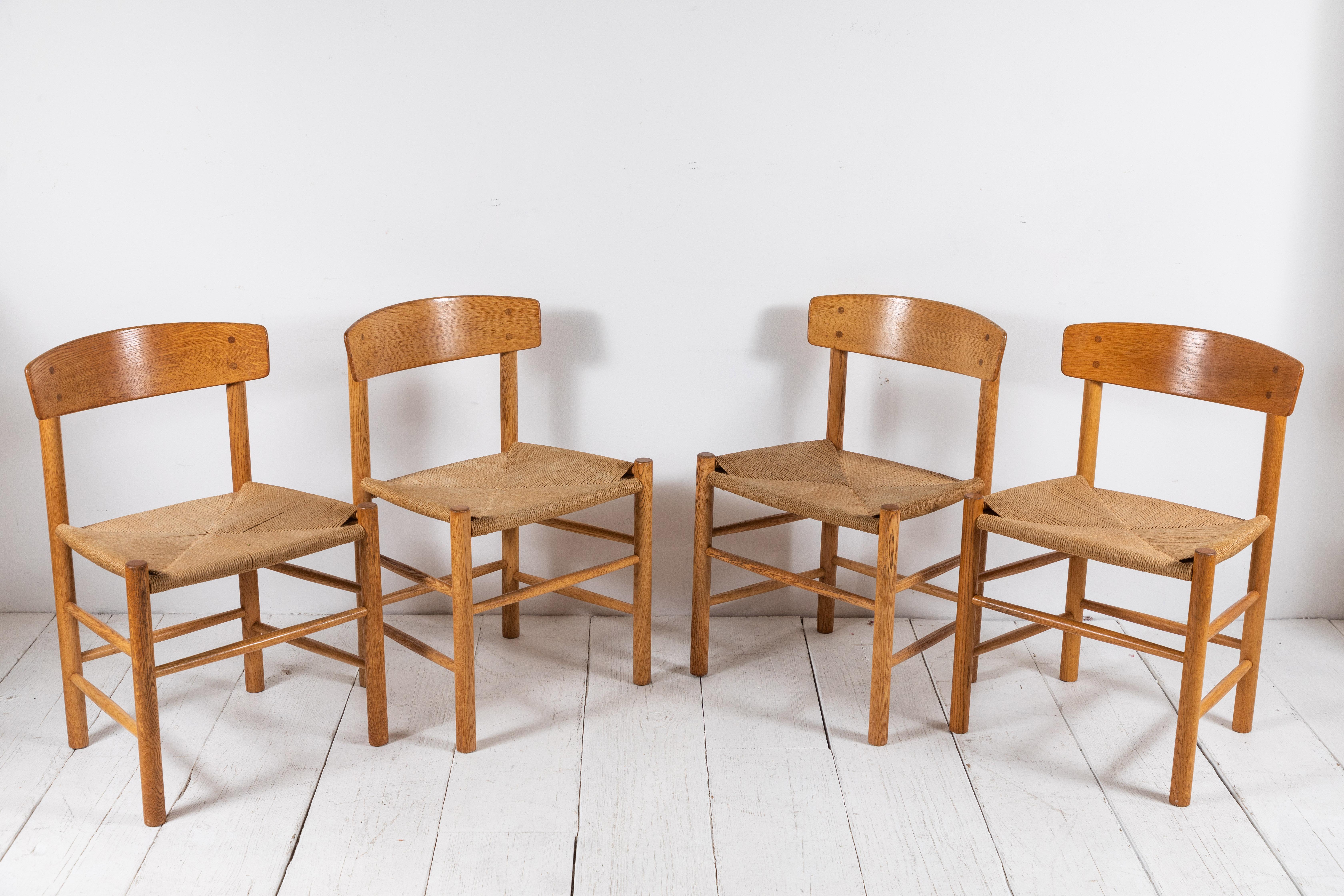 Set of four midcentury Børge Mogensen dining chairs with oak frame and rush seat.