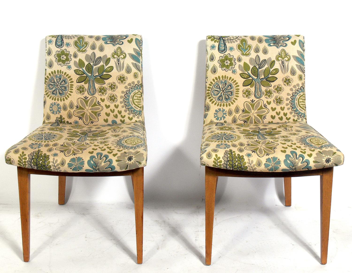 Set of four bracket back dining chairs, designed by Edward Wormley for Dunbar, American, circa 1950s. These chairs are currently being reupholstered and can be completed in your fabric at no additional charge. The price noted below includes