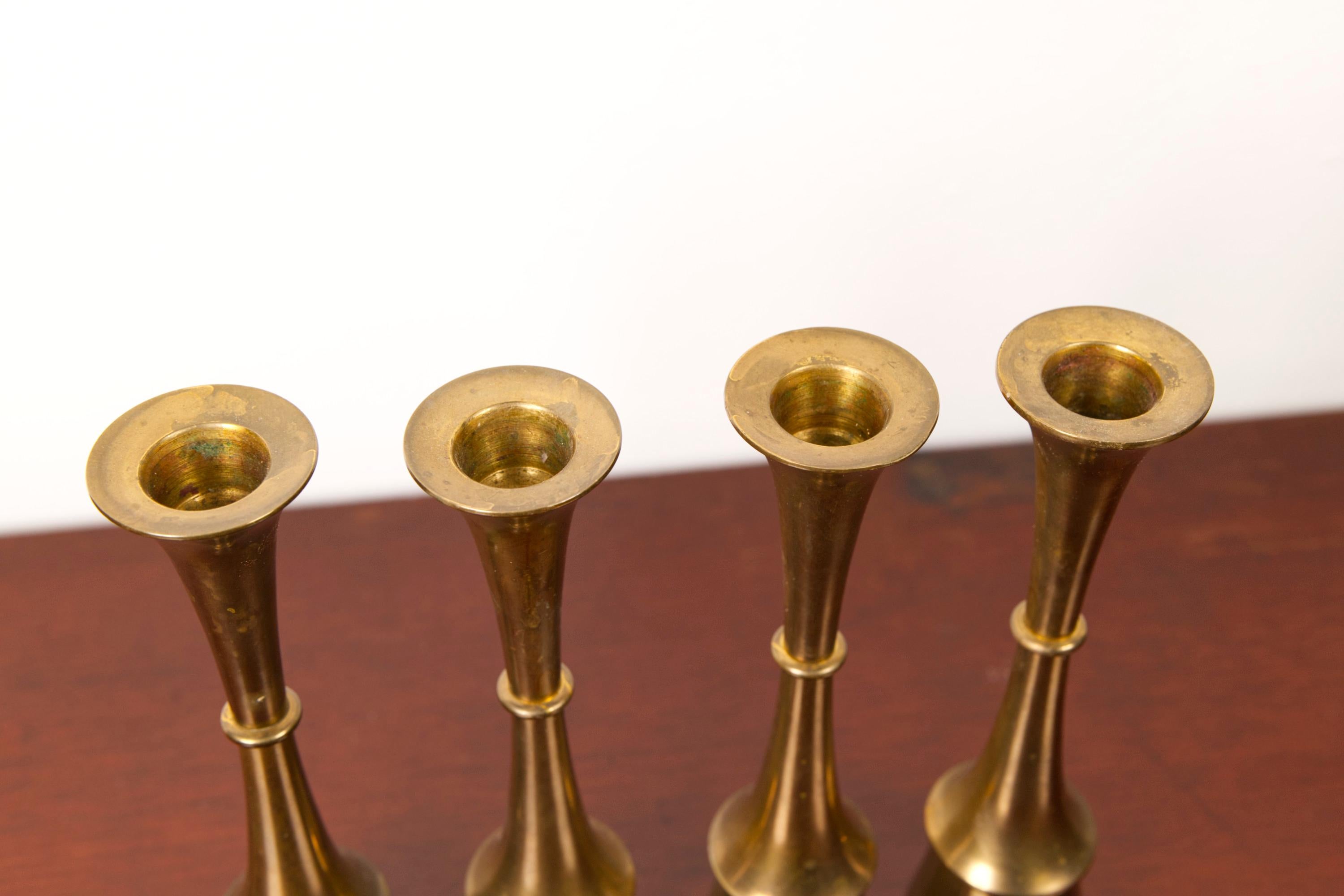 Milieu du XXe siècle Set of four brass candle sticks, attributed to Jens H. Quistgaard, 1960's en vente