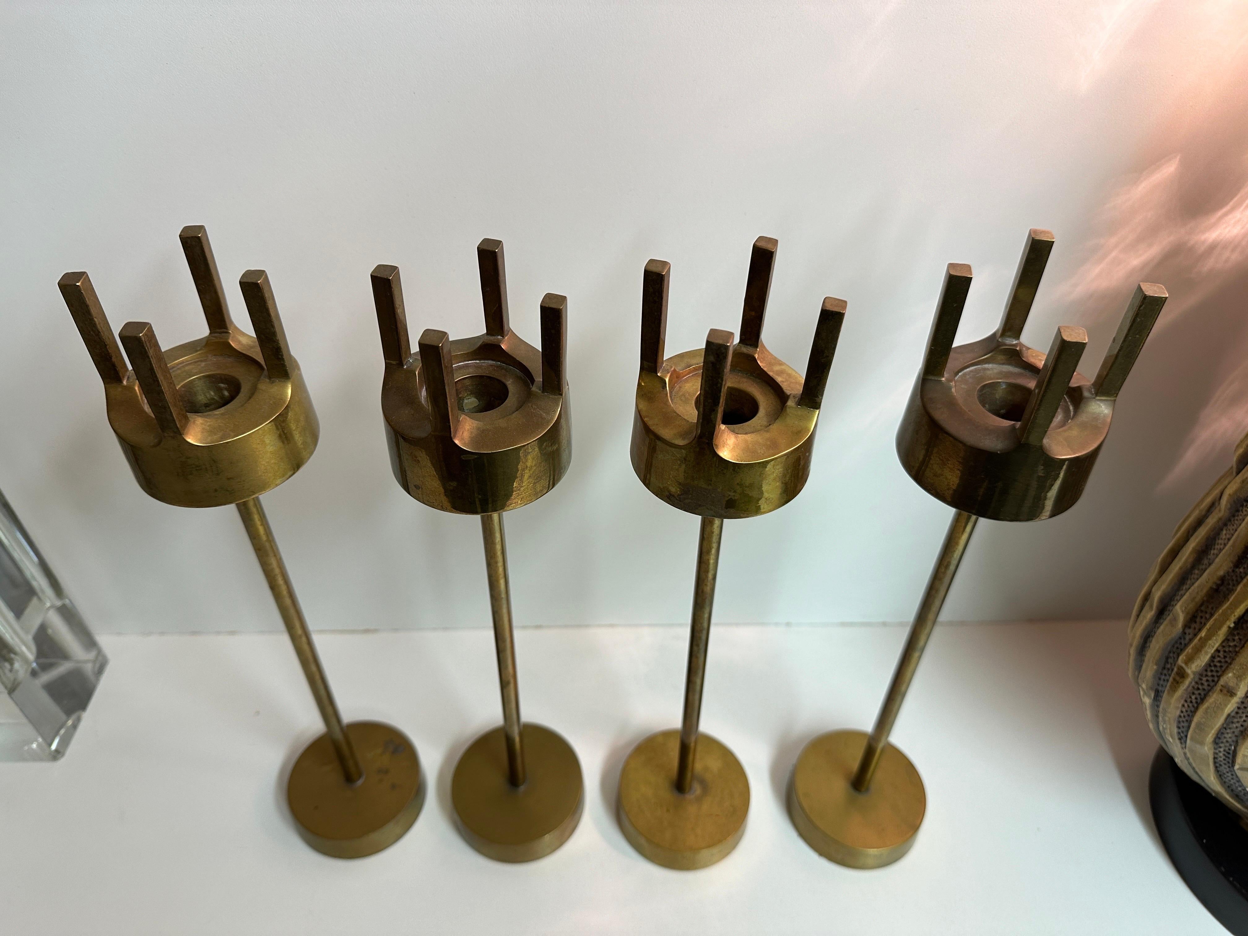 Patinated Set of Four Brass Candleholders For Sale
