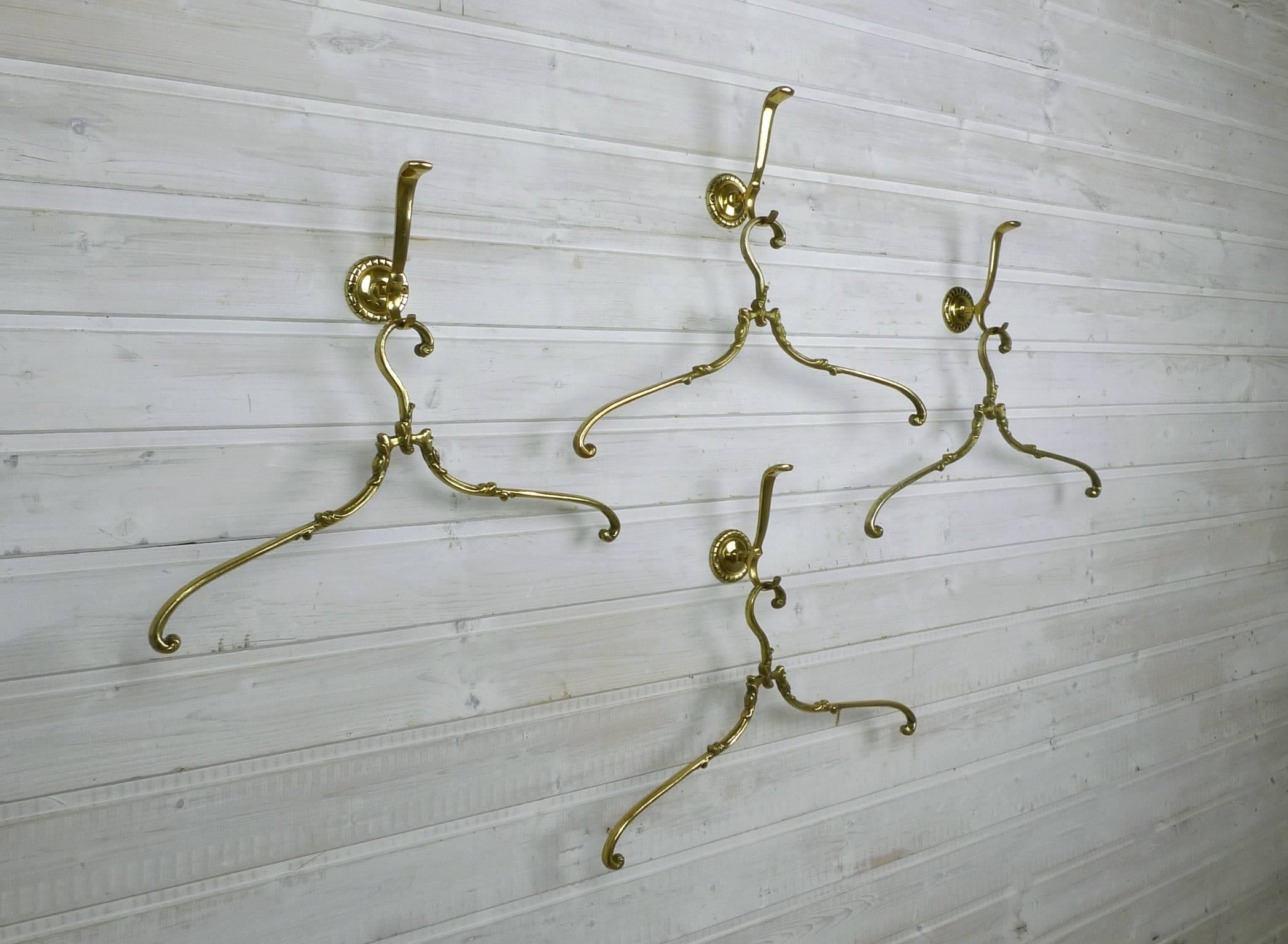 Set of four decorative coat hangers and matching hooks made of brass. Hangers and hooks were produced in Germany in the 1950s. A hook is 9 cm deep, 6 cm wide and 14 cm high. The measures of the coat hanger is shown below.
The set is in very good