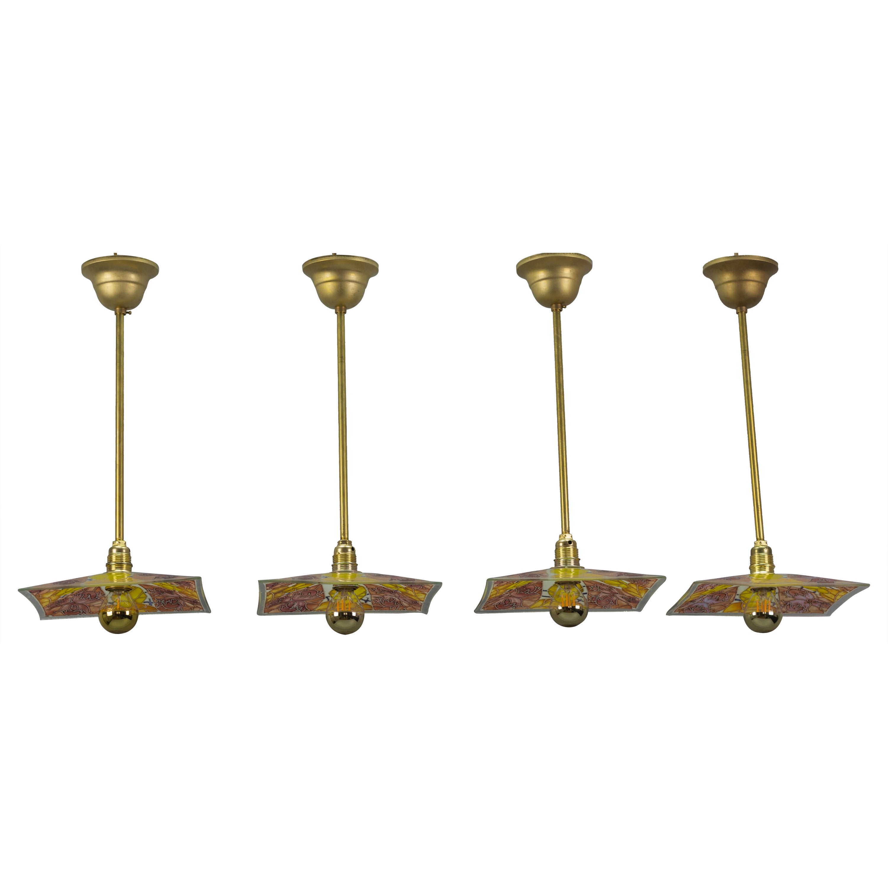 Ensemble de quatre lampes à suspension en laiton avec verre émaillé de Loys Lucha en vente