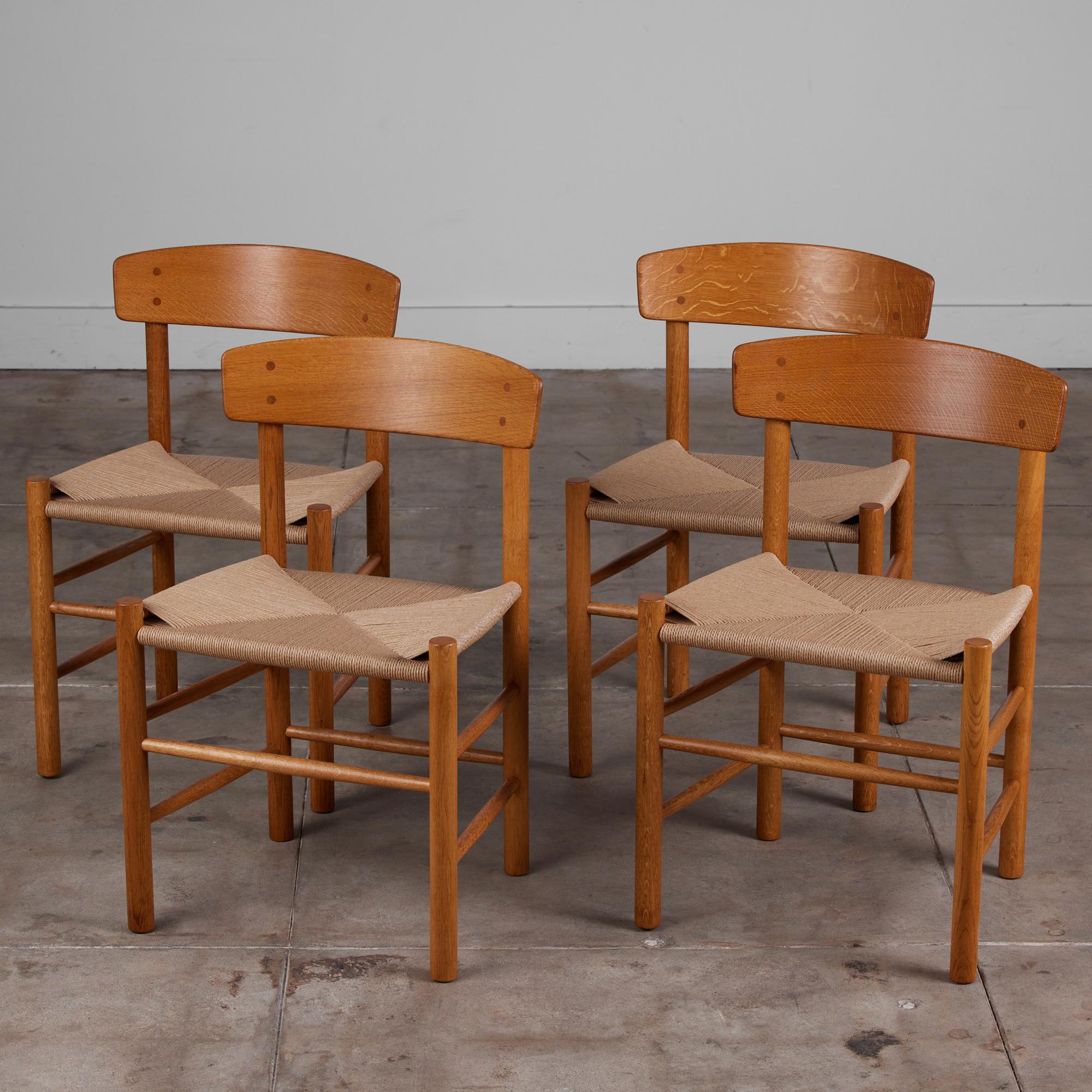 This set of oak Børge Mogensen dining chairs, Denmark, c.1950s, includes four side chairs. The chairs feature newly hand woven Danish cord seats.

Dimensions: ?19.5