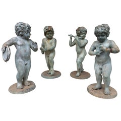 Set of Four Bronze Classical Style Musical Putti or Cherub Garden Statuary